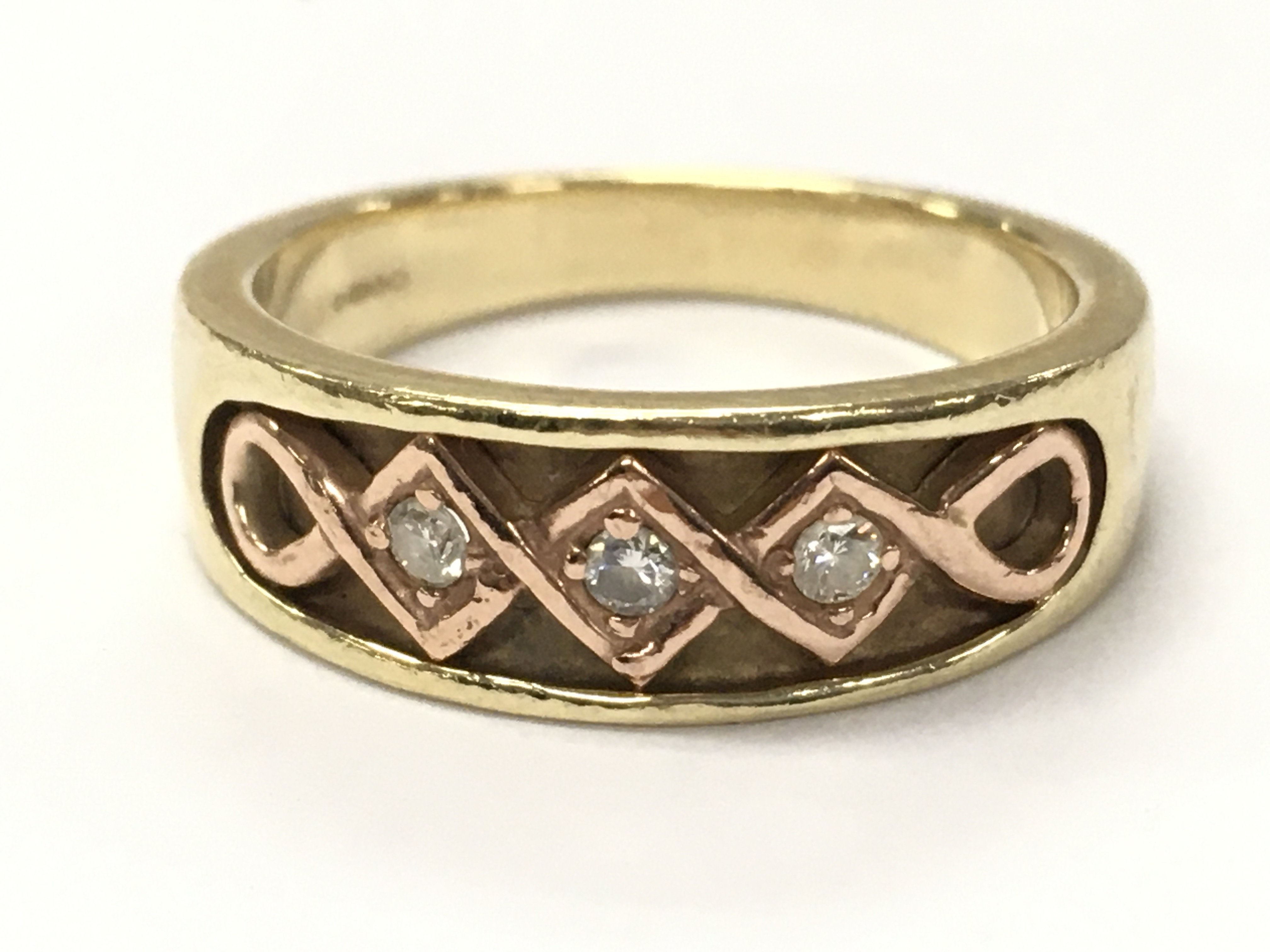 A 9ct gold ring set with diamond stones , size O , 4.9g total weight. postage category A