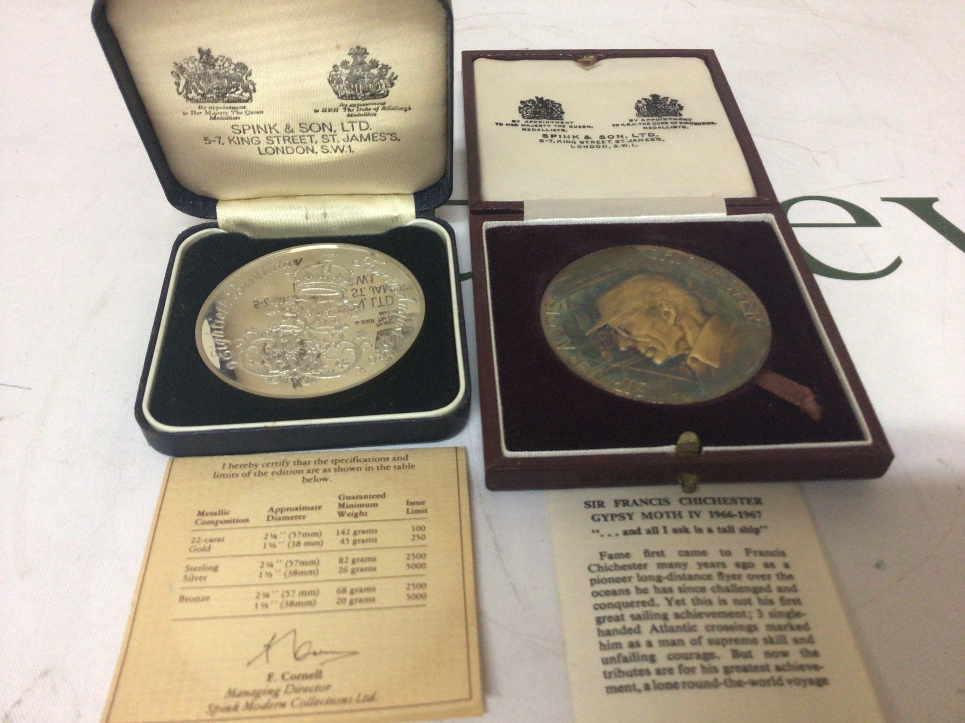A silver Queen Mum commemorative 1980 medal made by Spinks 82g Sterling Silver and a limited edition Silver Sir Francis Chichester Gypsy Moth IV Airanortrcal Medallion with signed certification. (2)
