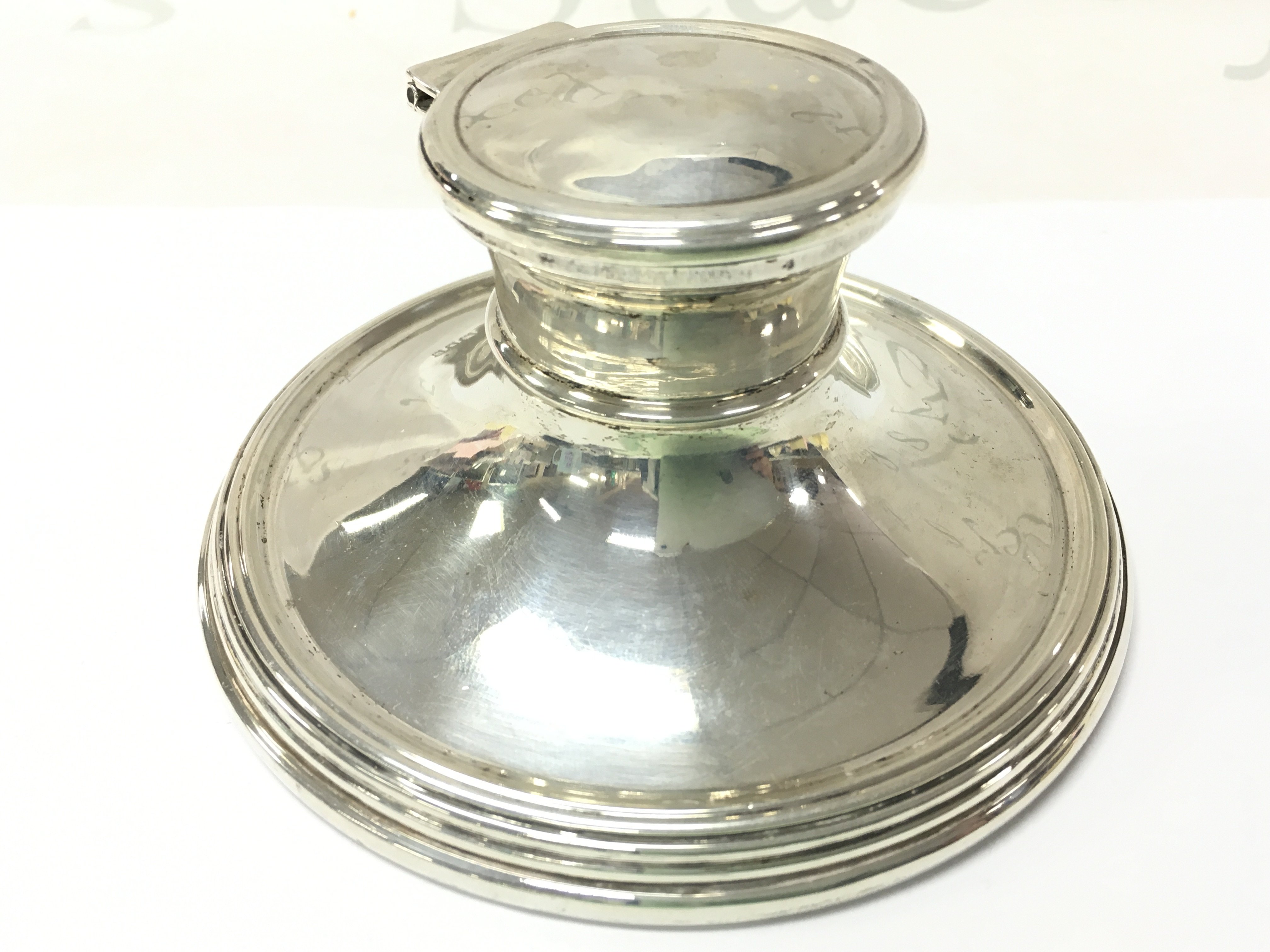 A silver capstan inkwell, 7cm tall. postage catB