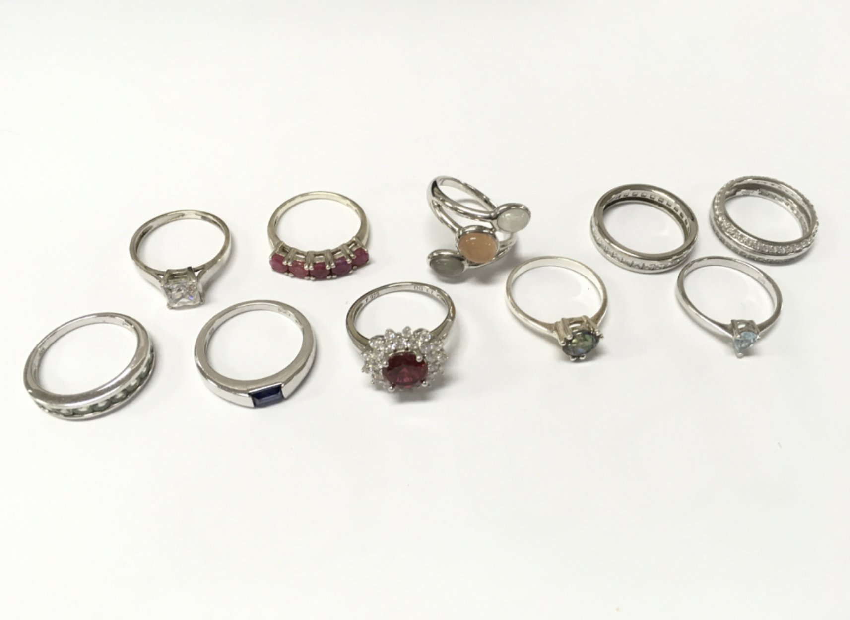 A collection of silver dress rings , mostly size P. Postage catA