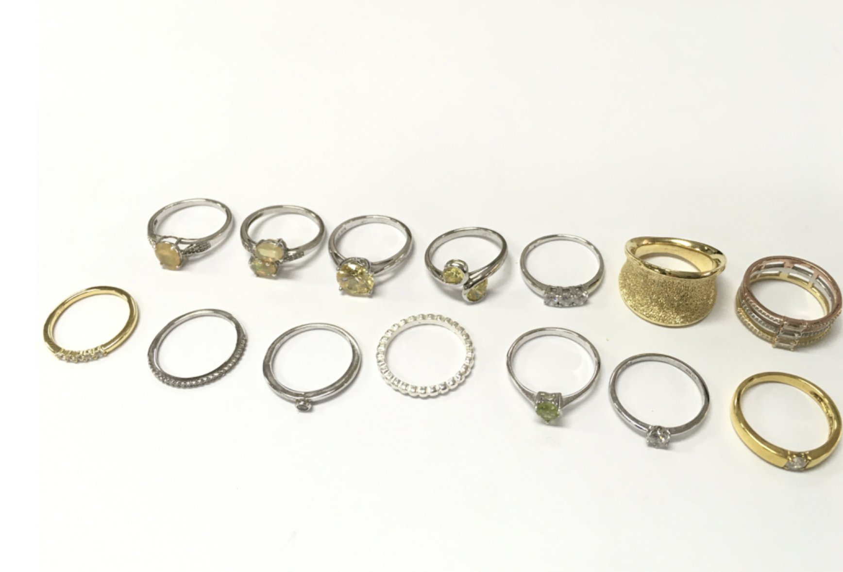 Silver and other dress rings set with various stones including Opal. Postage category A