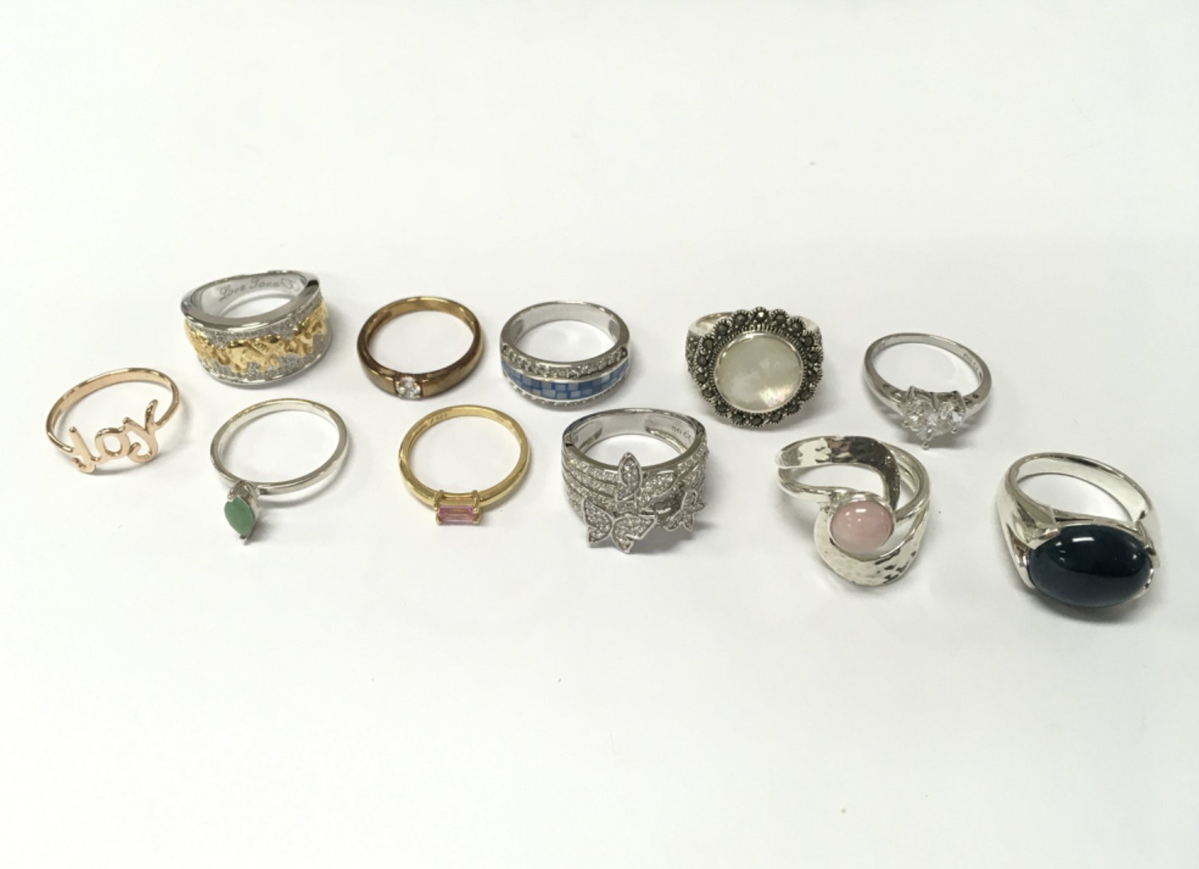 A collection of silver dress rings set with various stones . Postage category A