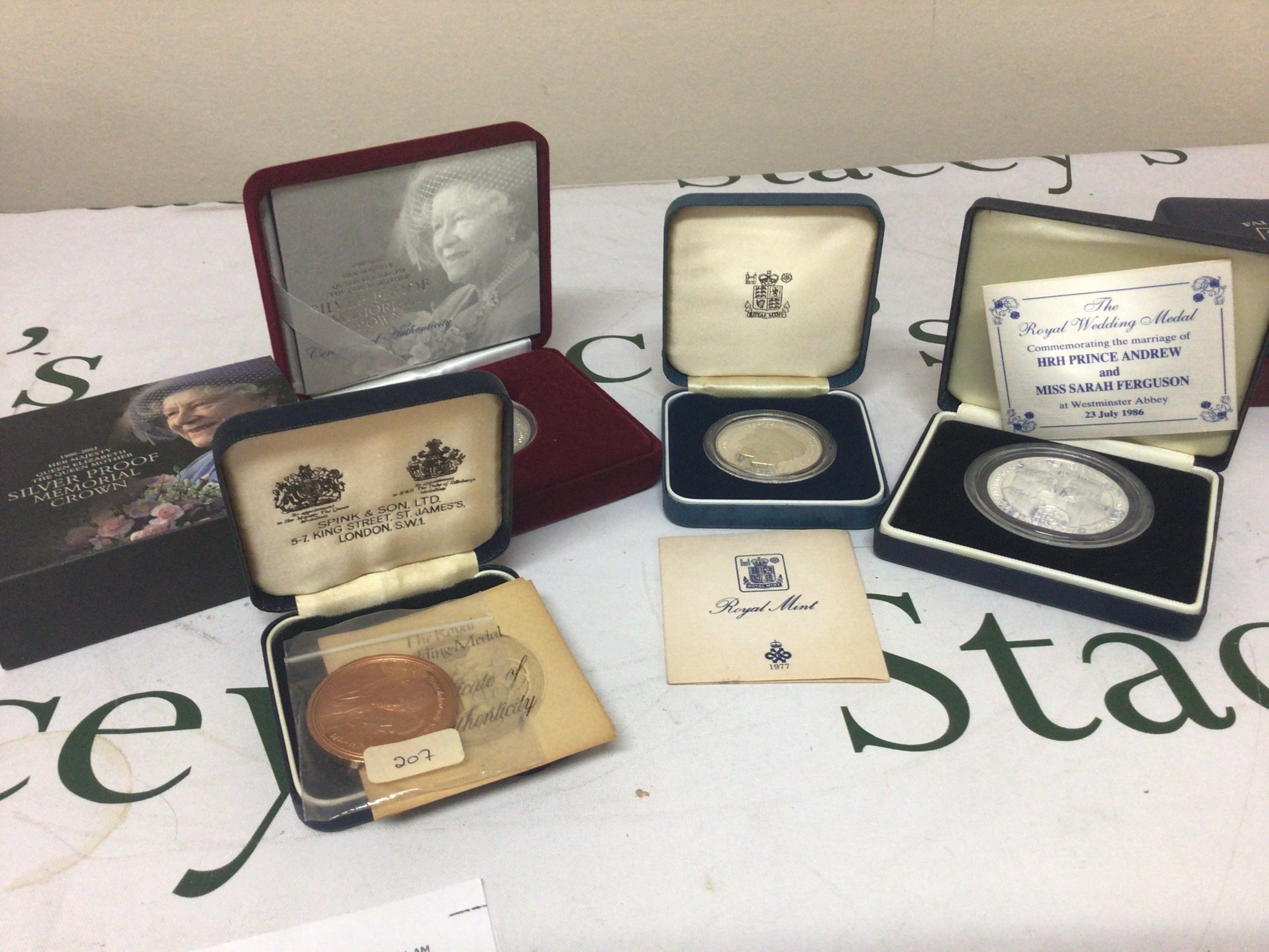 A collection of three silver commemorative coins and a bronze coin (4)