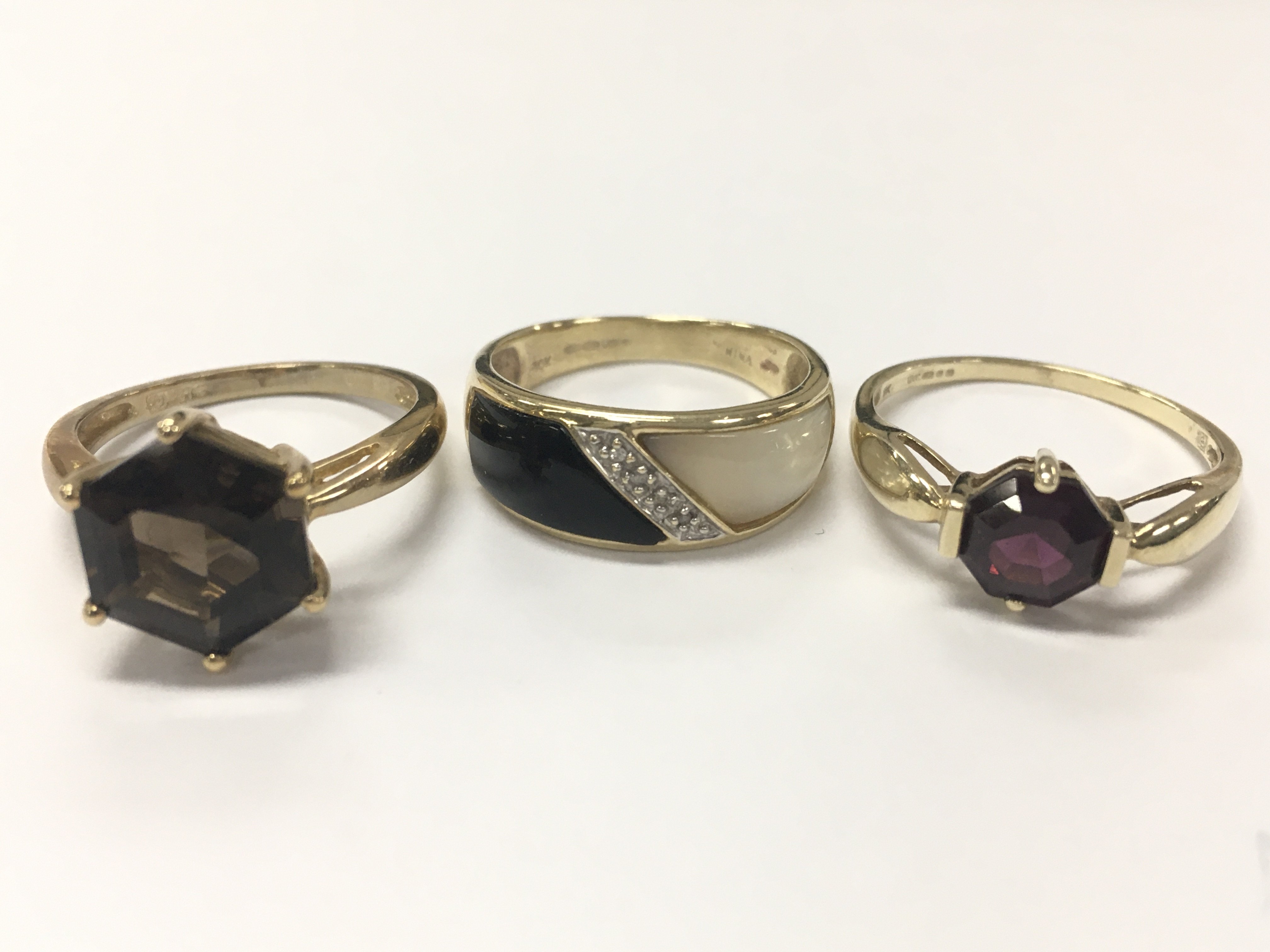 10 carat and two 9 carat gold rings . 8.4g total weight. Size R,P,O. Postage catA