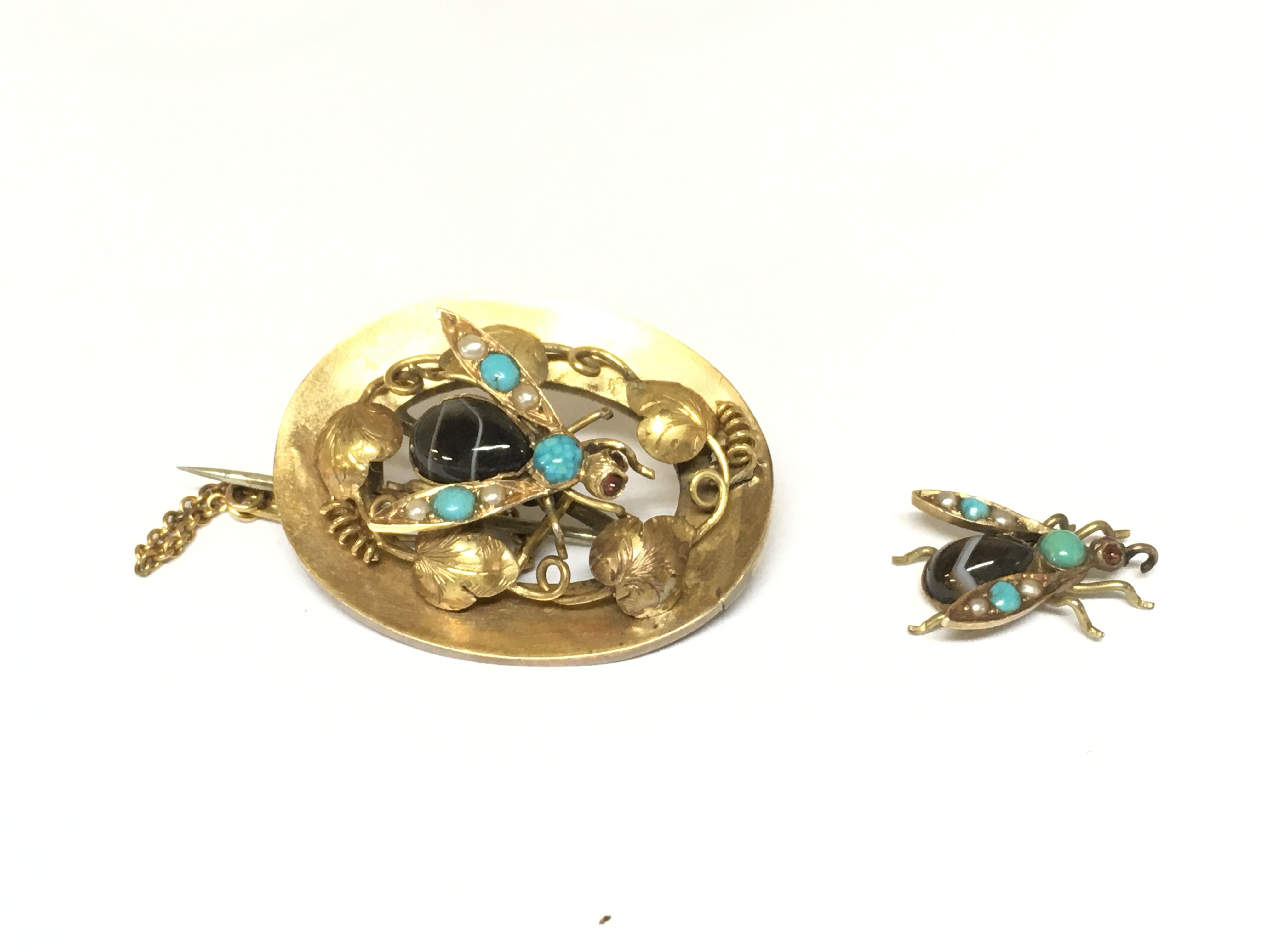 A yellow metal bug brooch set with seed pearls and turquoise and a bug pendent (bale broken) 8.67g
