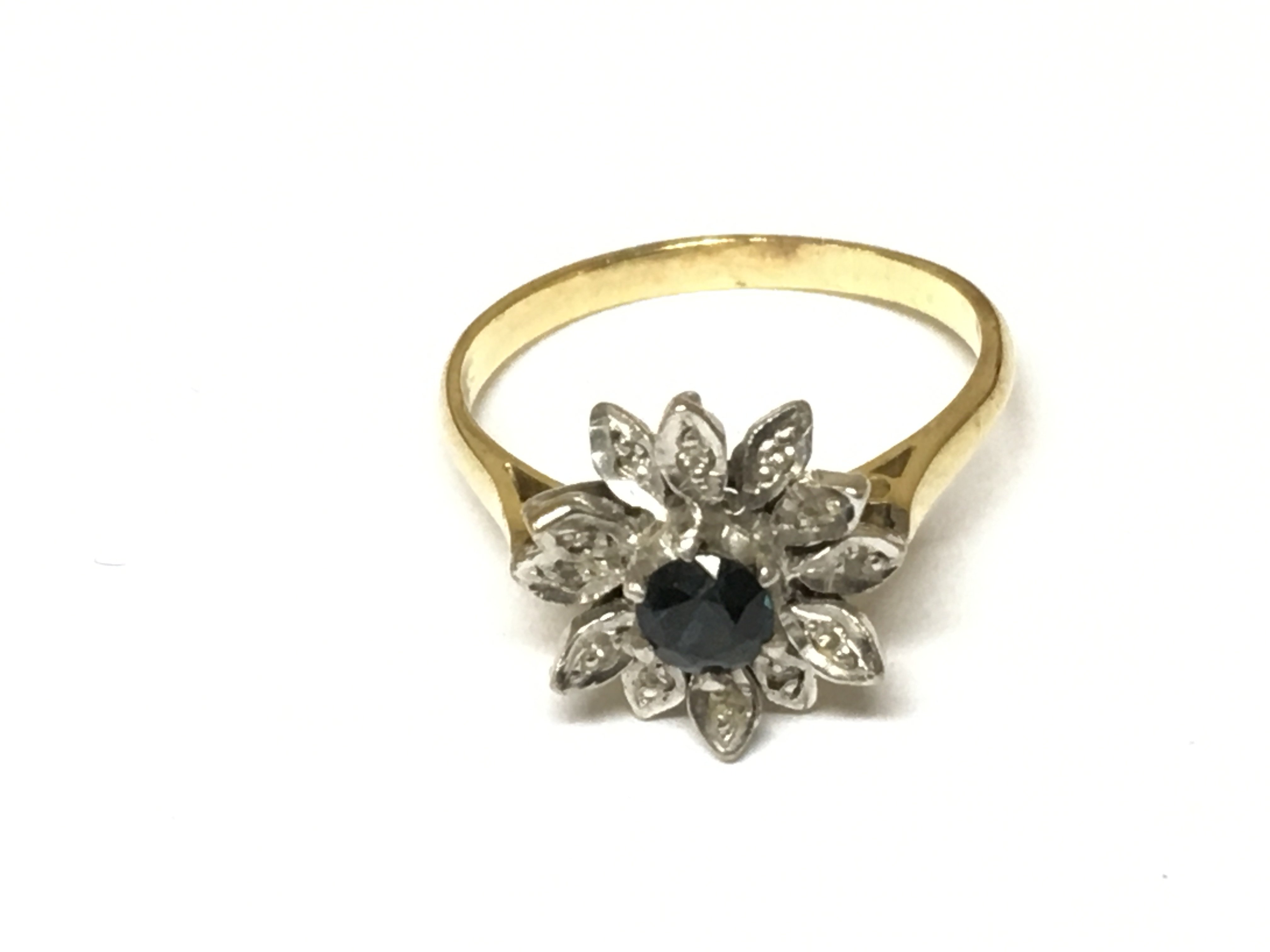 An 18ct gold Florian ring set with sapphire. Size T and 5.06g