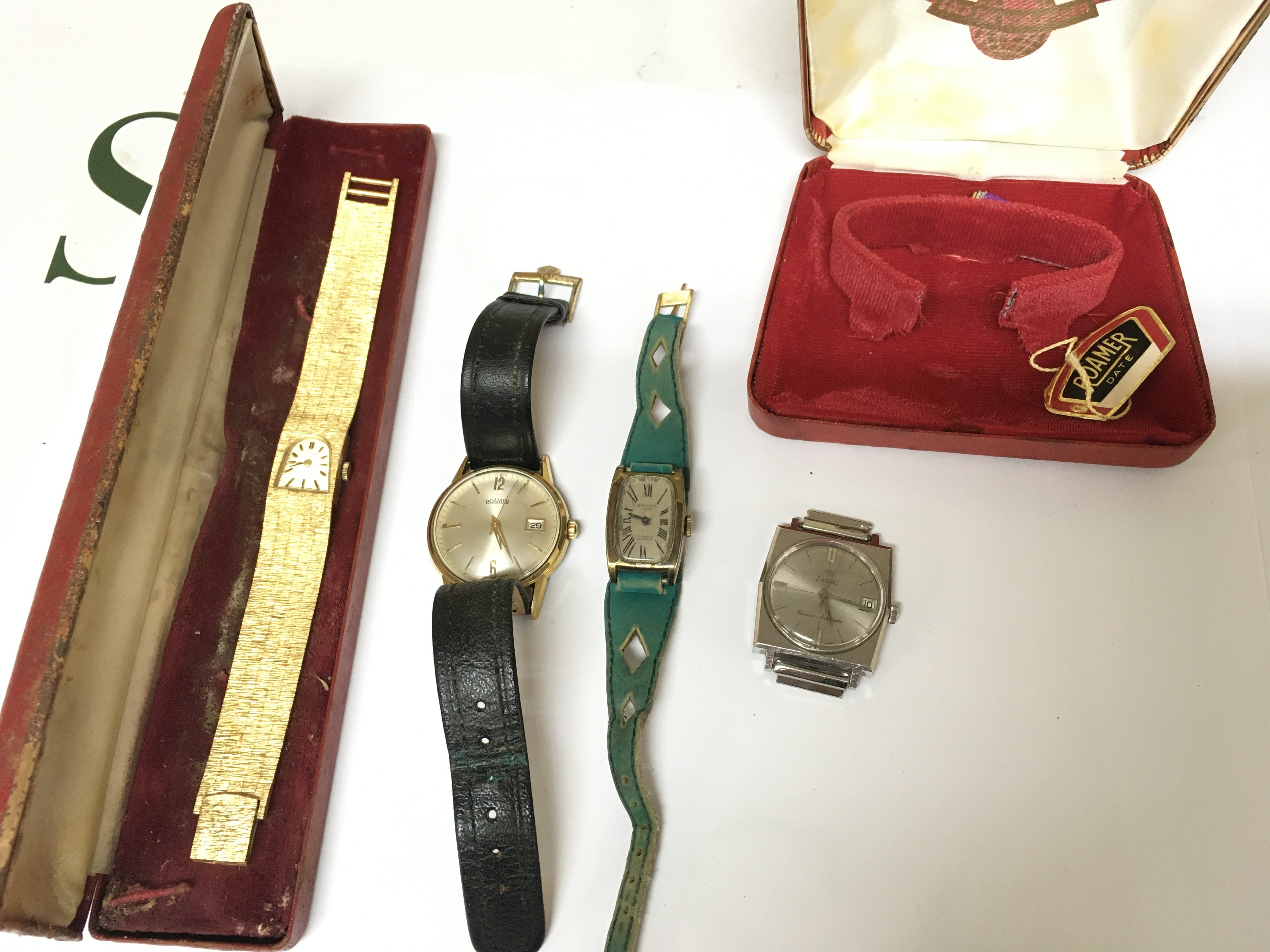 A collection of four watches including Roamer etc.