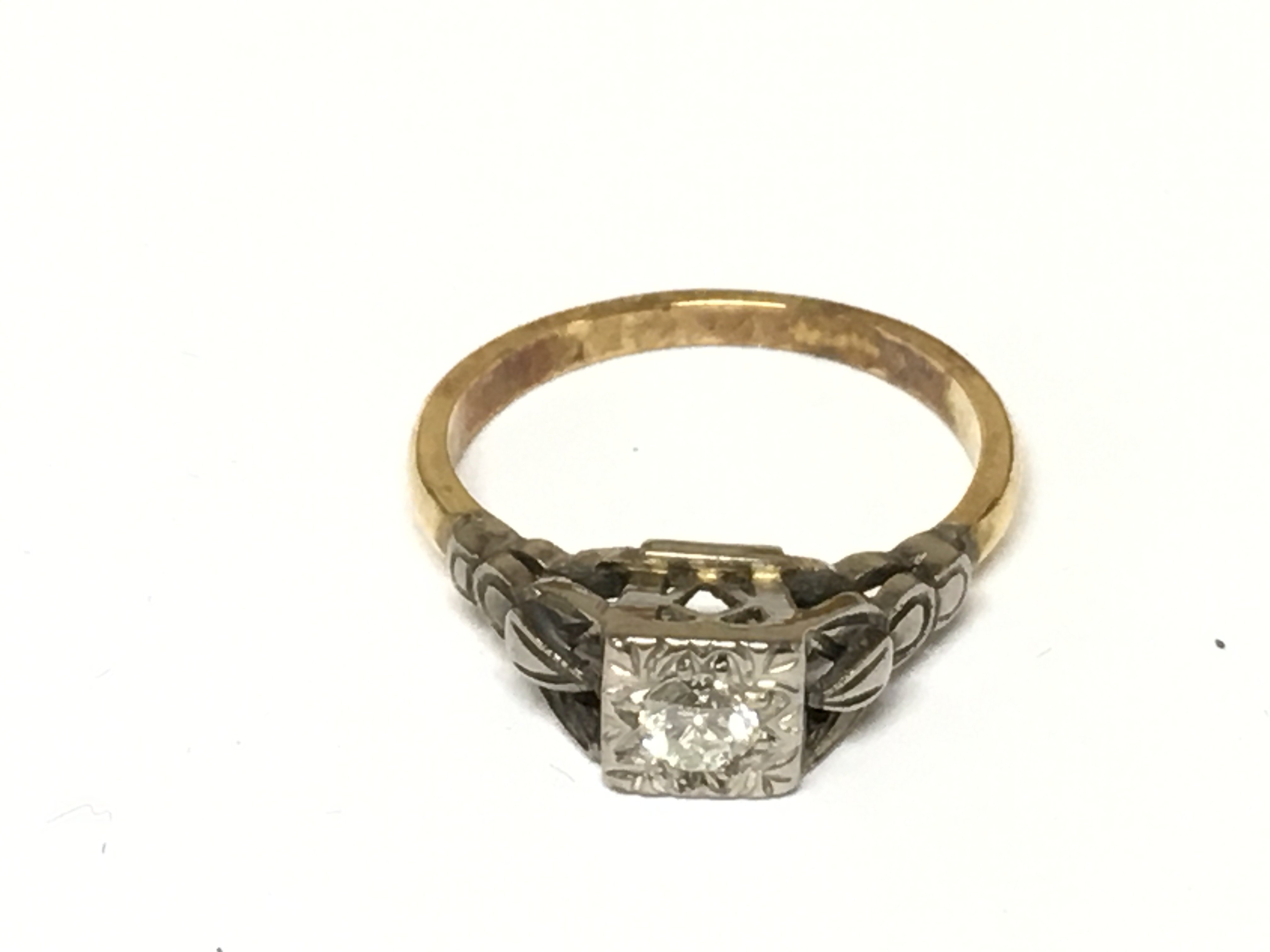 An 18ct gold and platinum diamond set ring. 2.89g size K 1/2