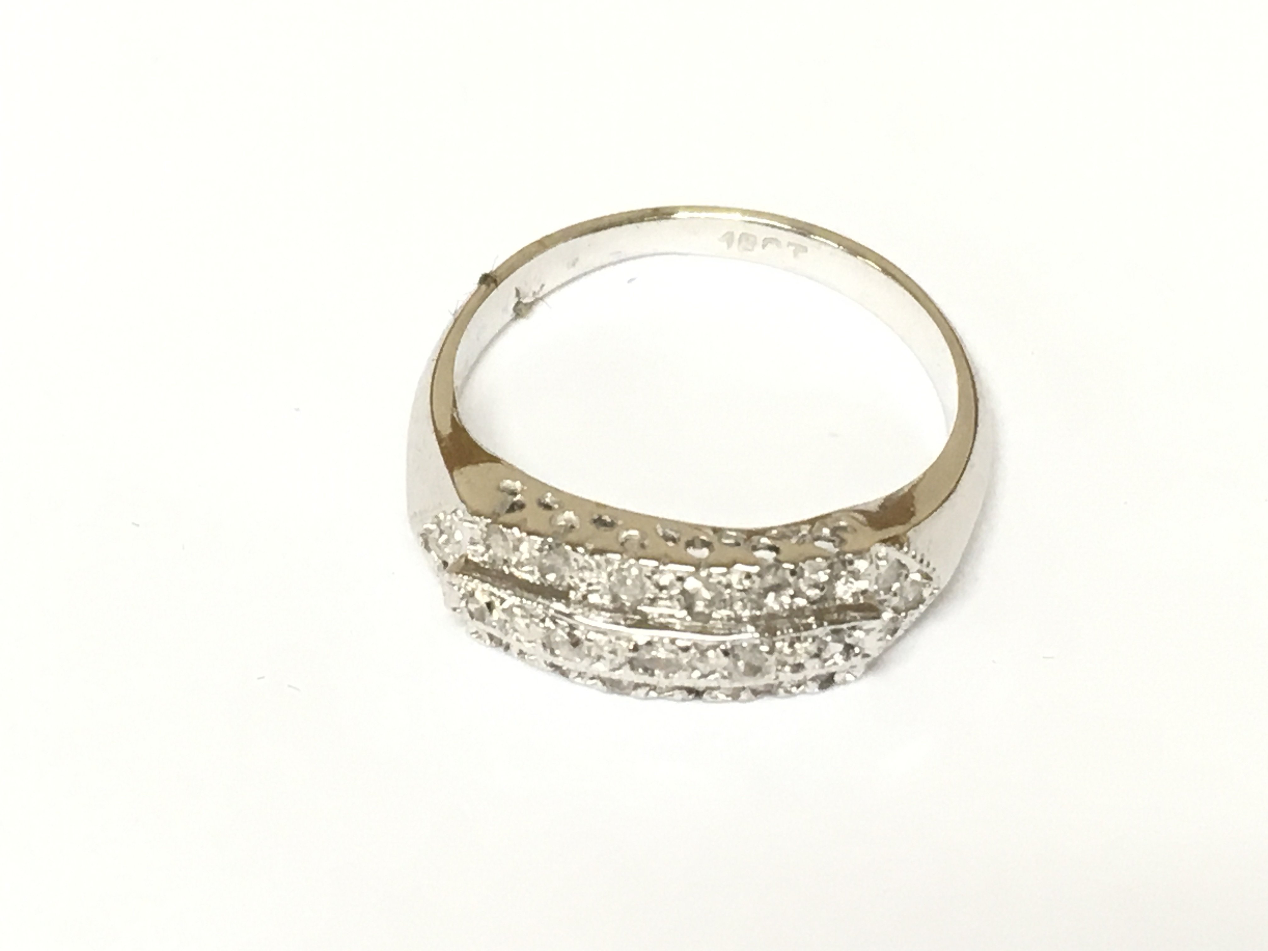 An 18ct white gold ring set with diamonds. Size N 1/2 and 4g