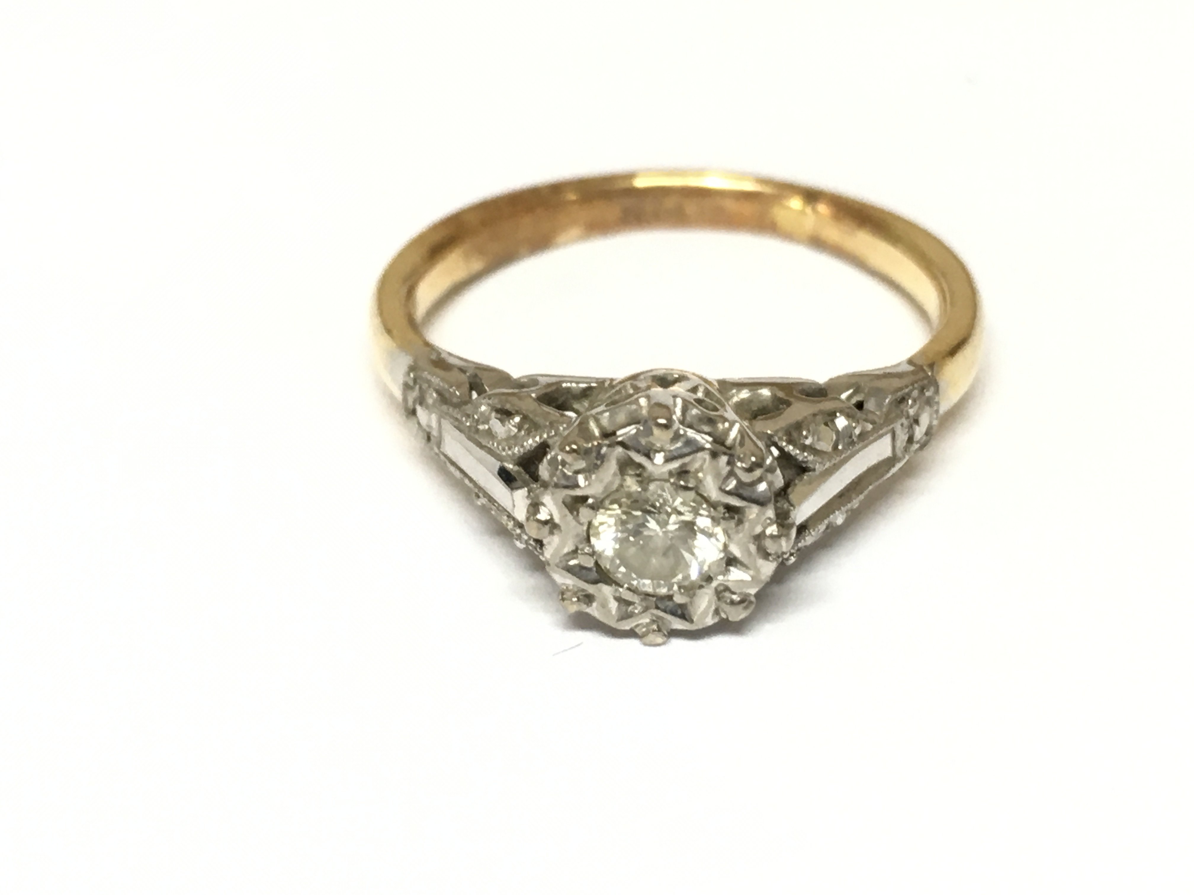 An 18ct gold ring set with diamond. Size I 1/2 and 2.82g