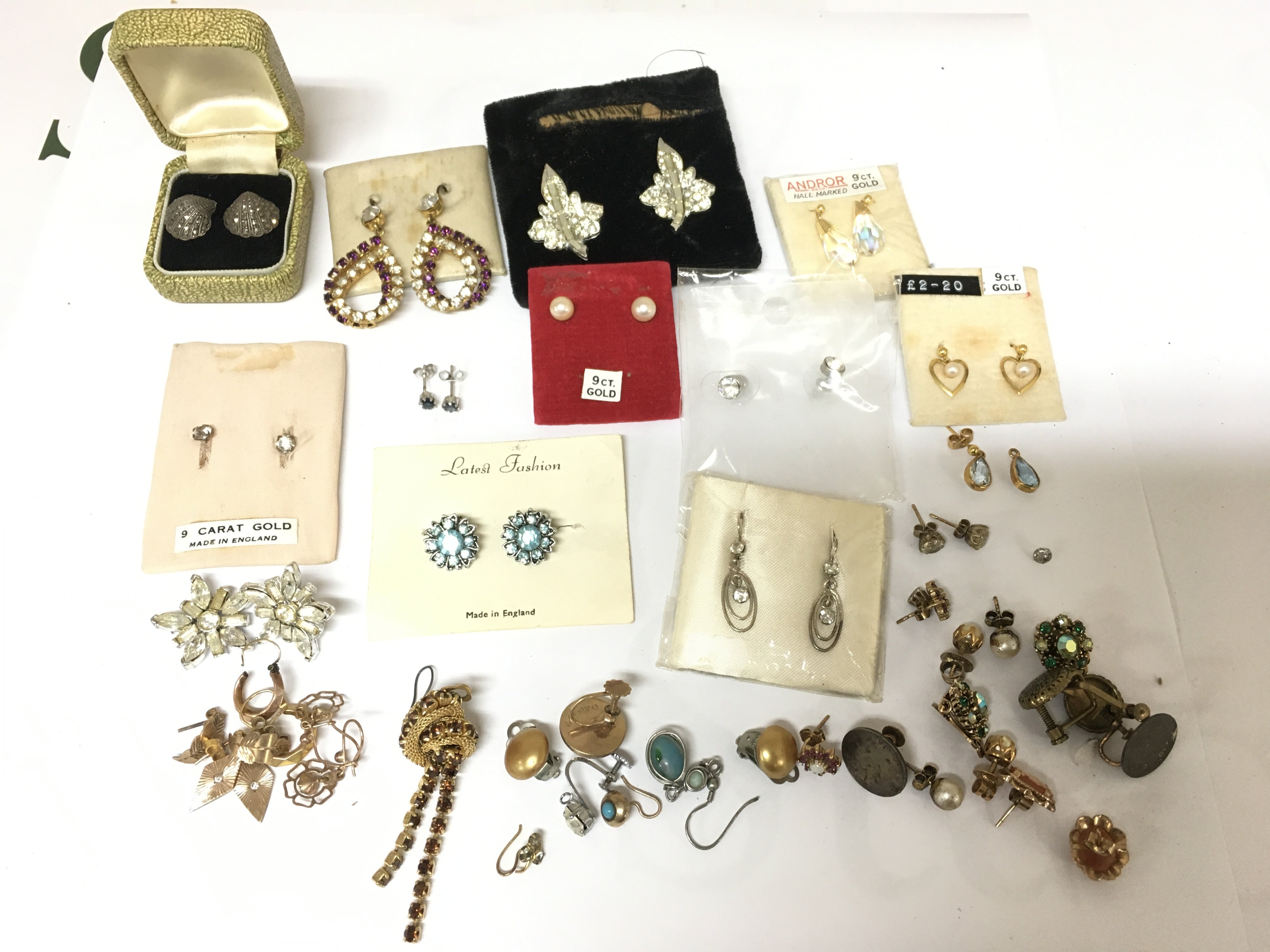 A collection of assorted earrings including a number of gold examples. Postage B