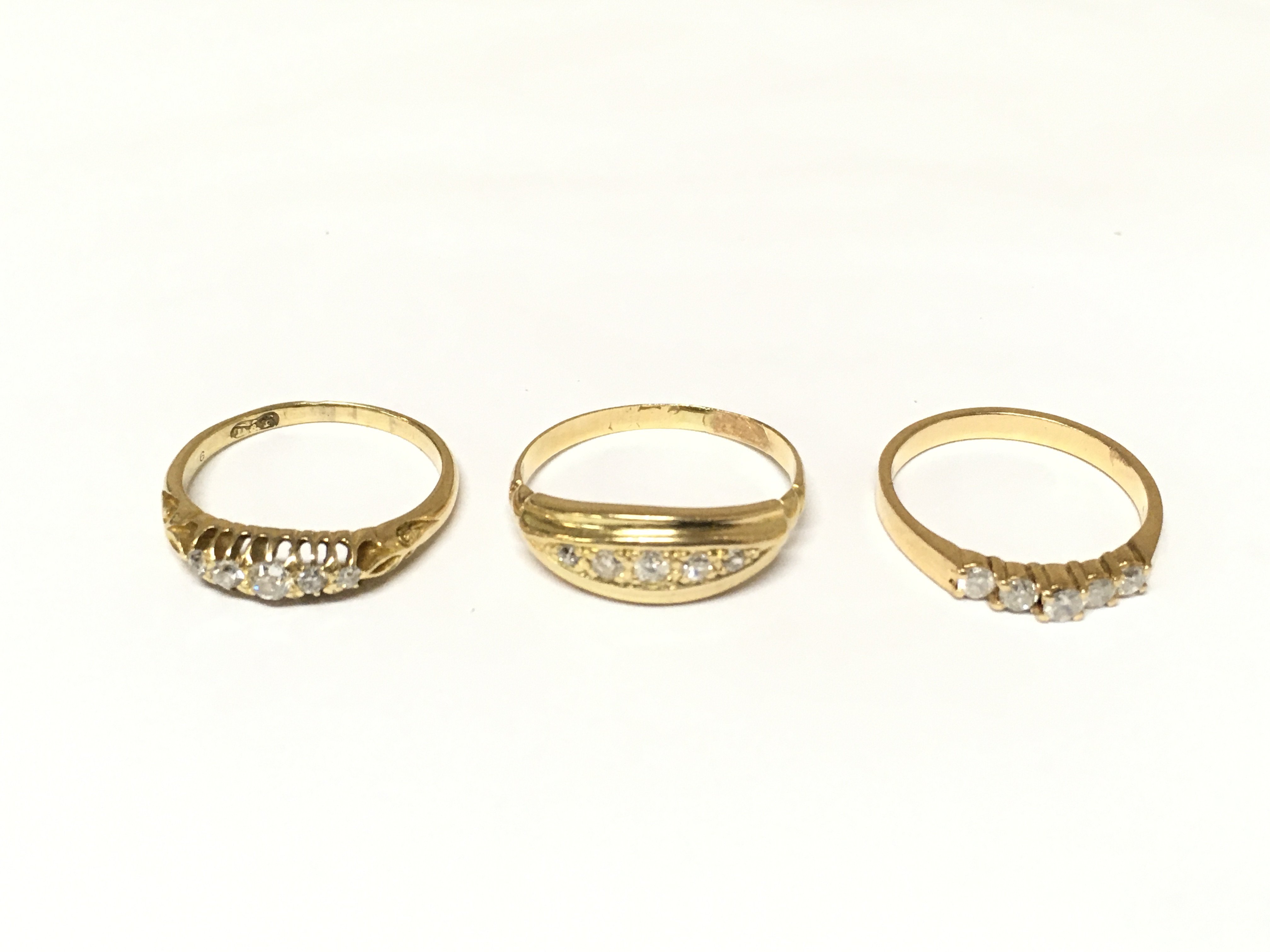 Three unhallmarked 5 stone set diamond rings. Approximately 6.8g and sizes L L 1/2 and O