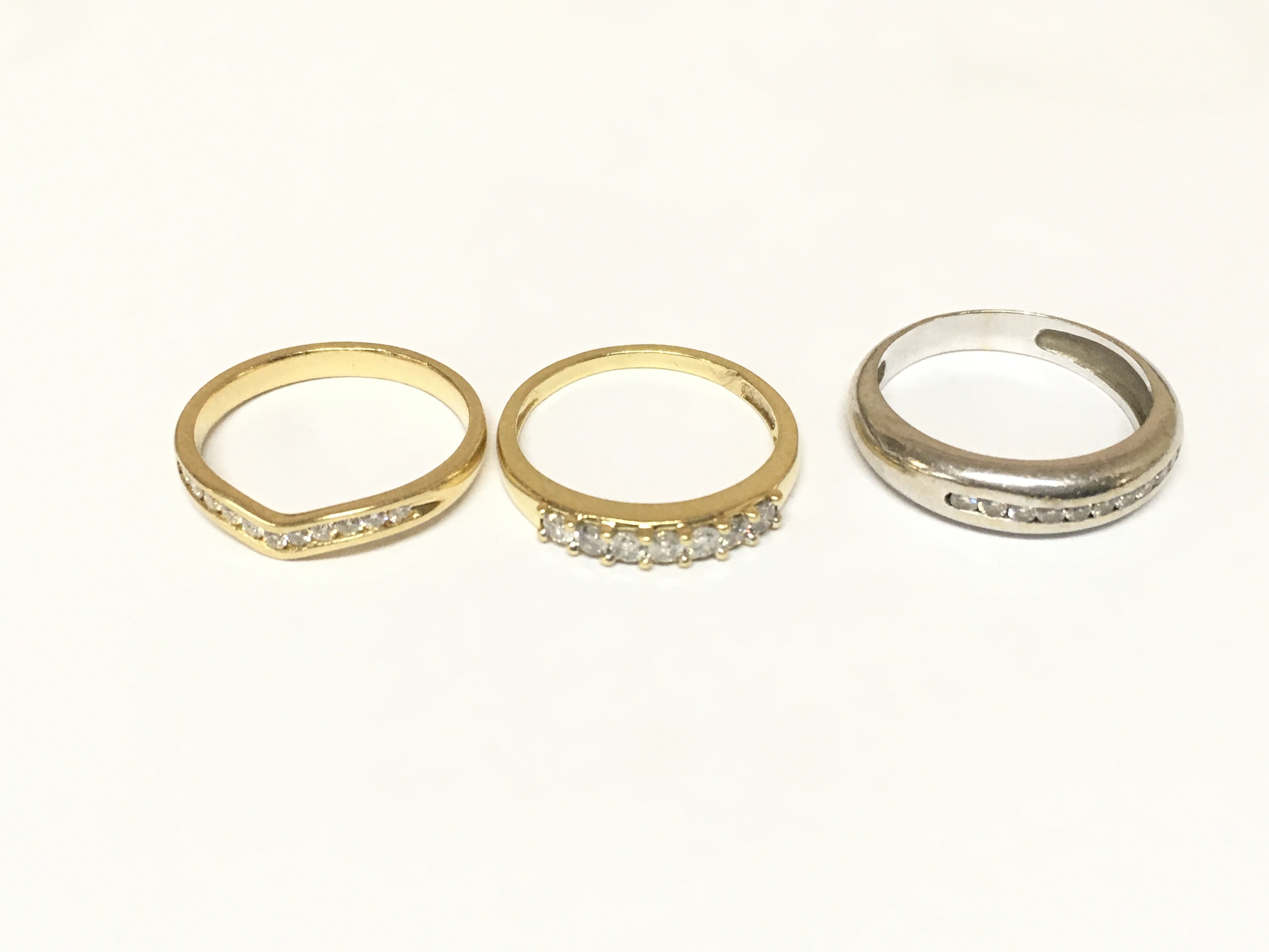 Three diamond half hoop diamond rings. Approximately 9.9g and Sizes M N and O