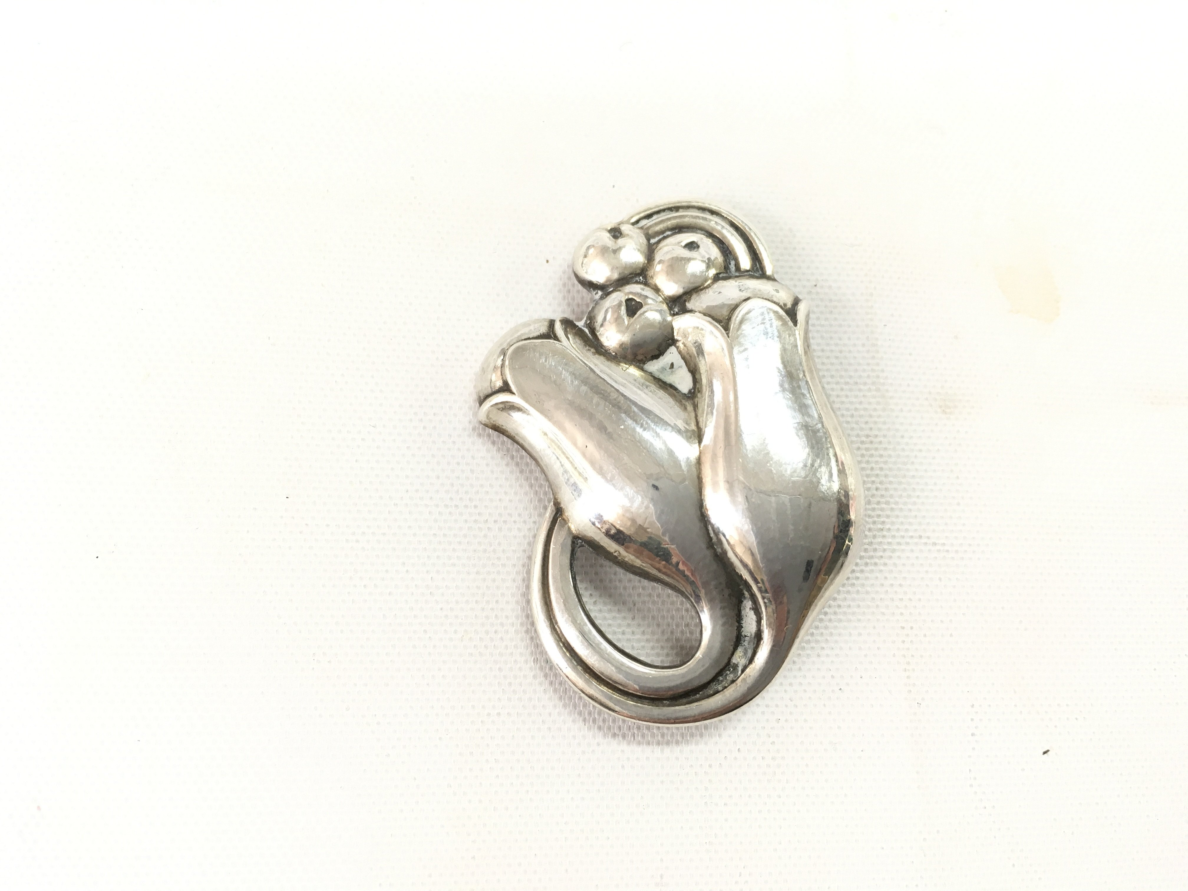 A Georg Jenson silver tulip brooch model number 100. Postage A