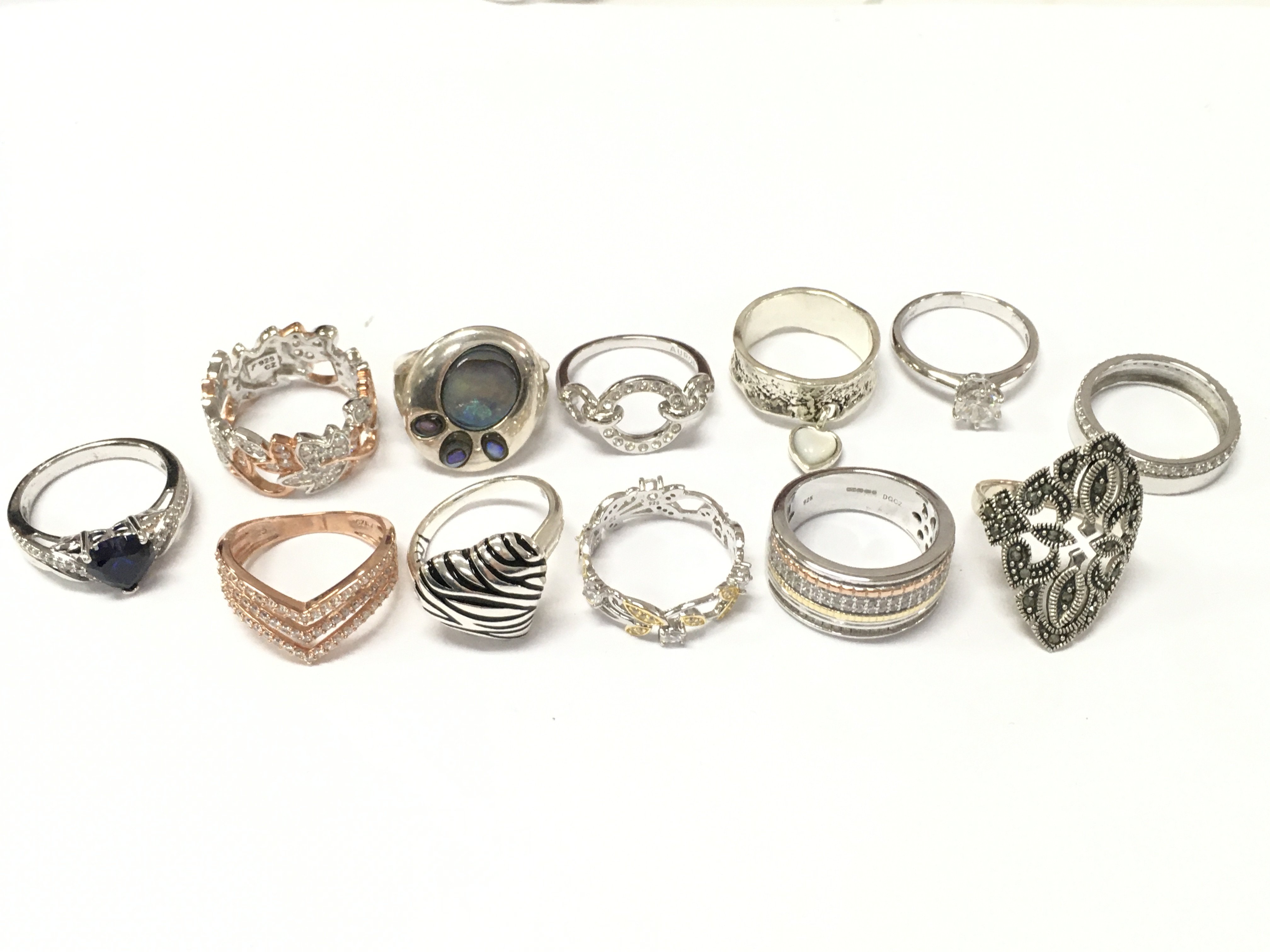 A Collection of silver rings , also including non silver rings. Ring sizes P & O. 56g total lot weight. Postage category A
