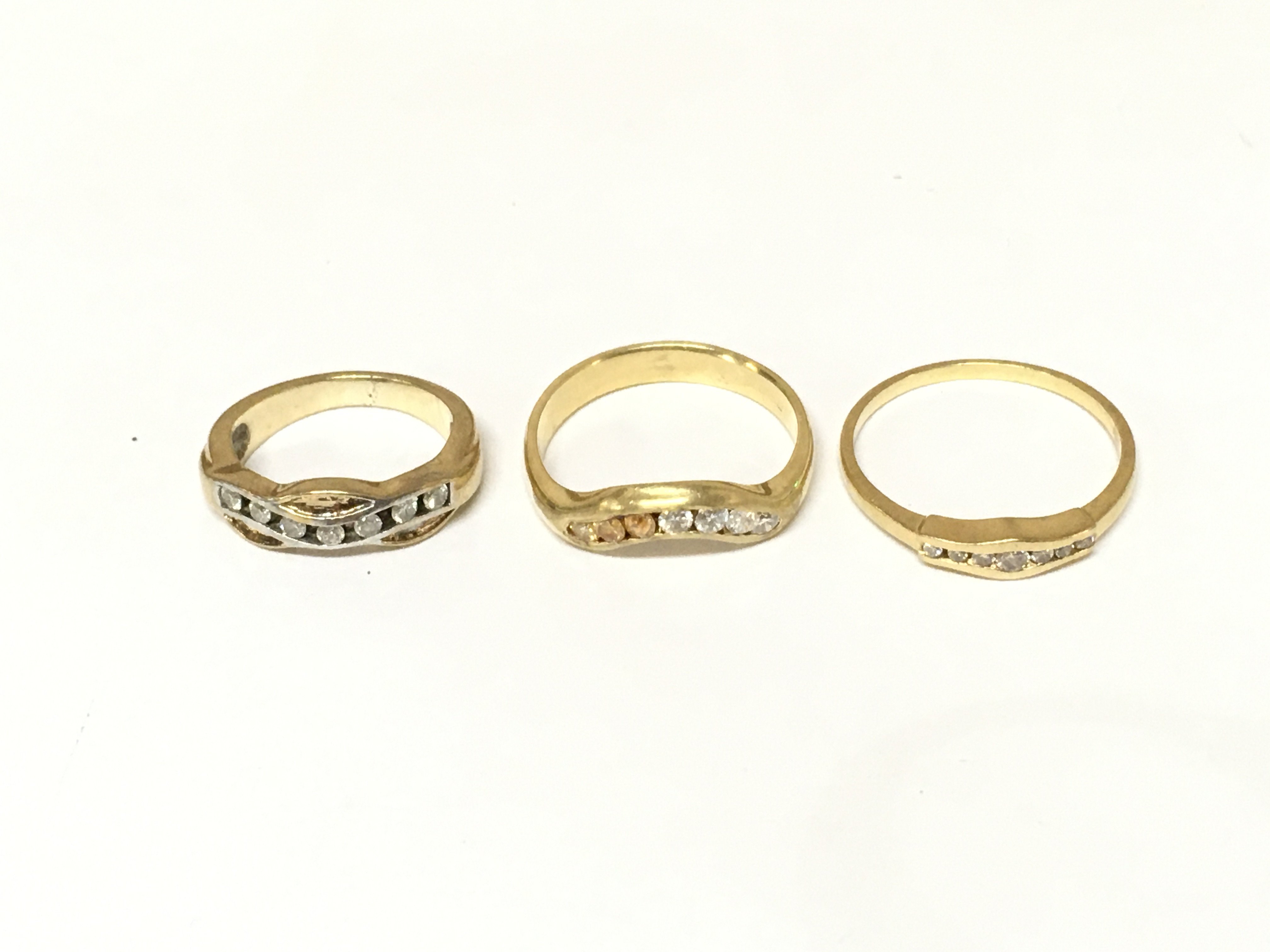 Three unmarked rings set with diamonds. Approximately 9.8g and sizes H P and Q