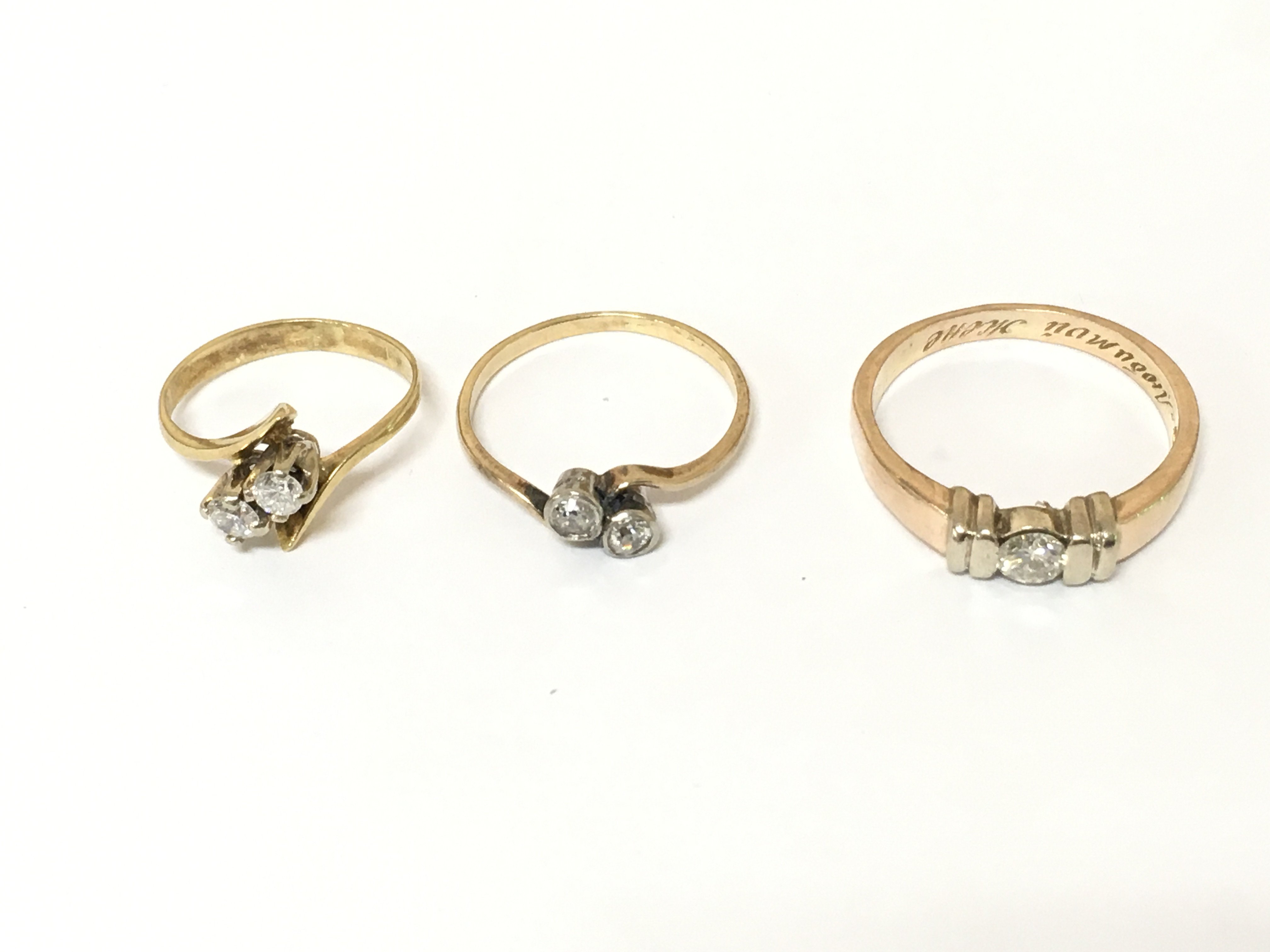 Three unmarked rings set with diamonds. Approximately 6.4g sizes f1/2 K and P