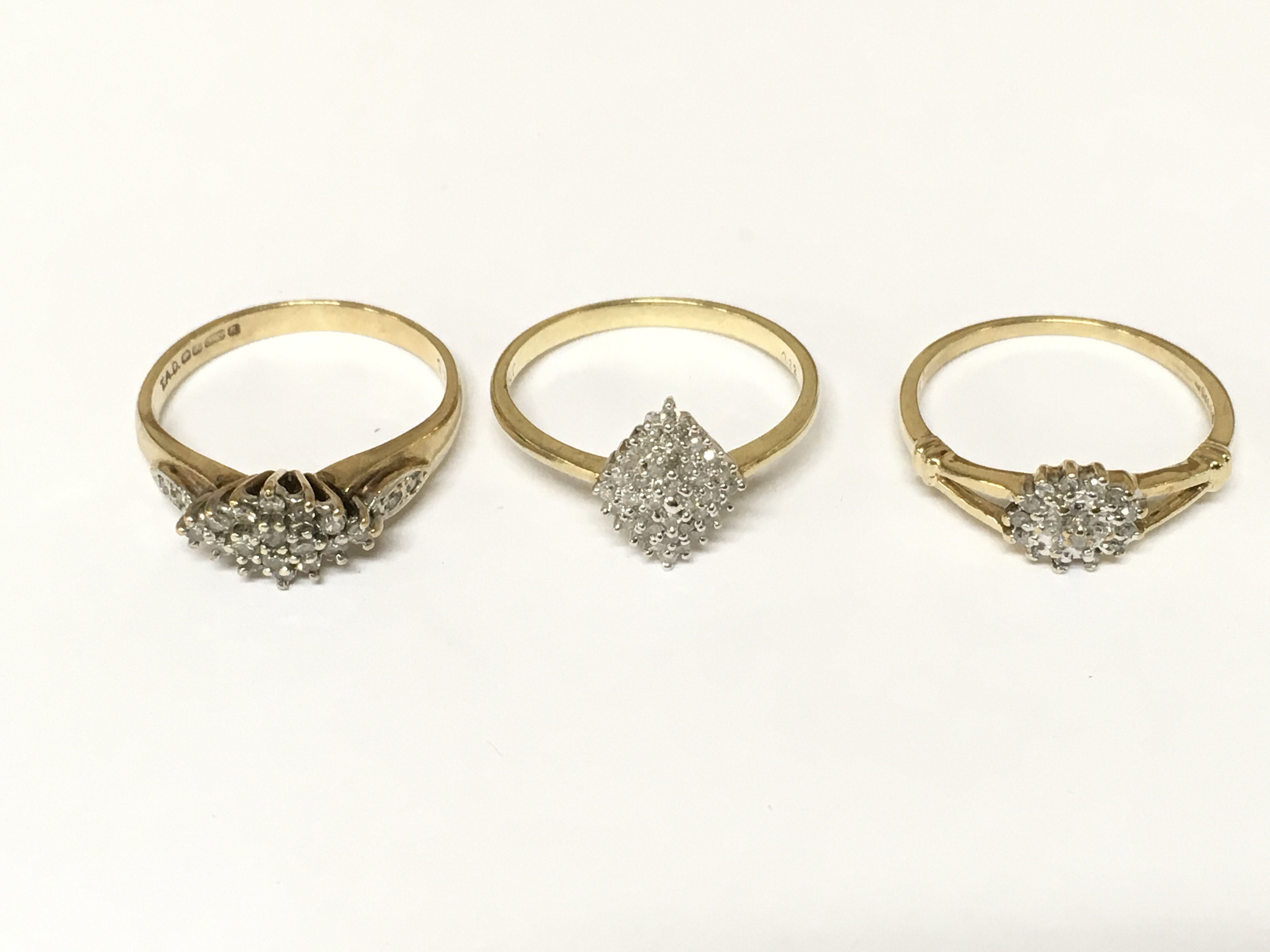 Three 9ct gold diamond cluster rings. Approximately 5.7g sizes O and P