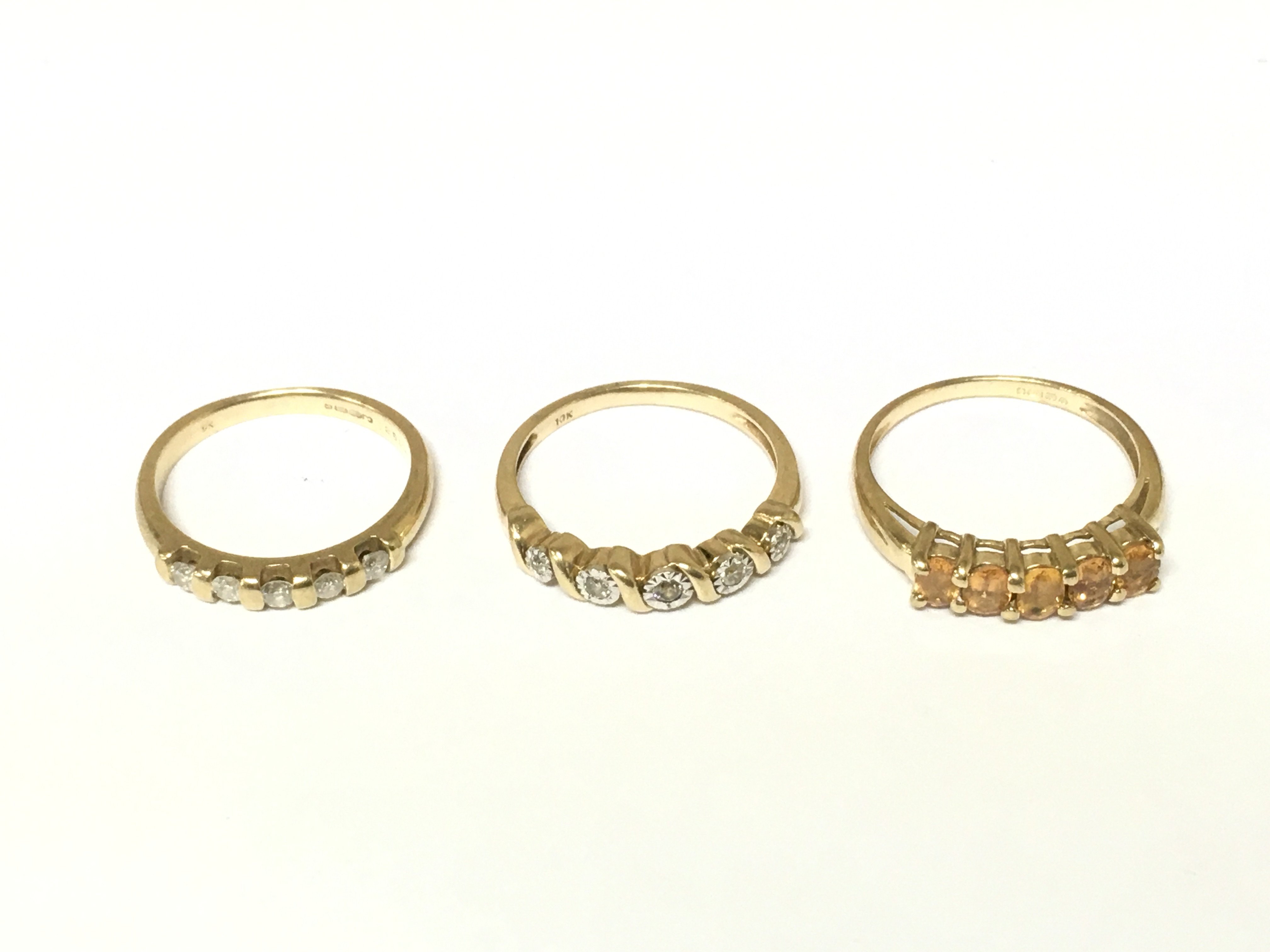 Two 9ct gold 5 stone diamond ring and a 9ct gold 5 stone citrine ring. Approximately 6.3g and Sizes K N and O