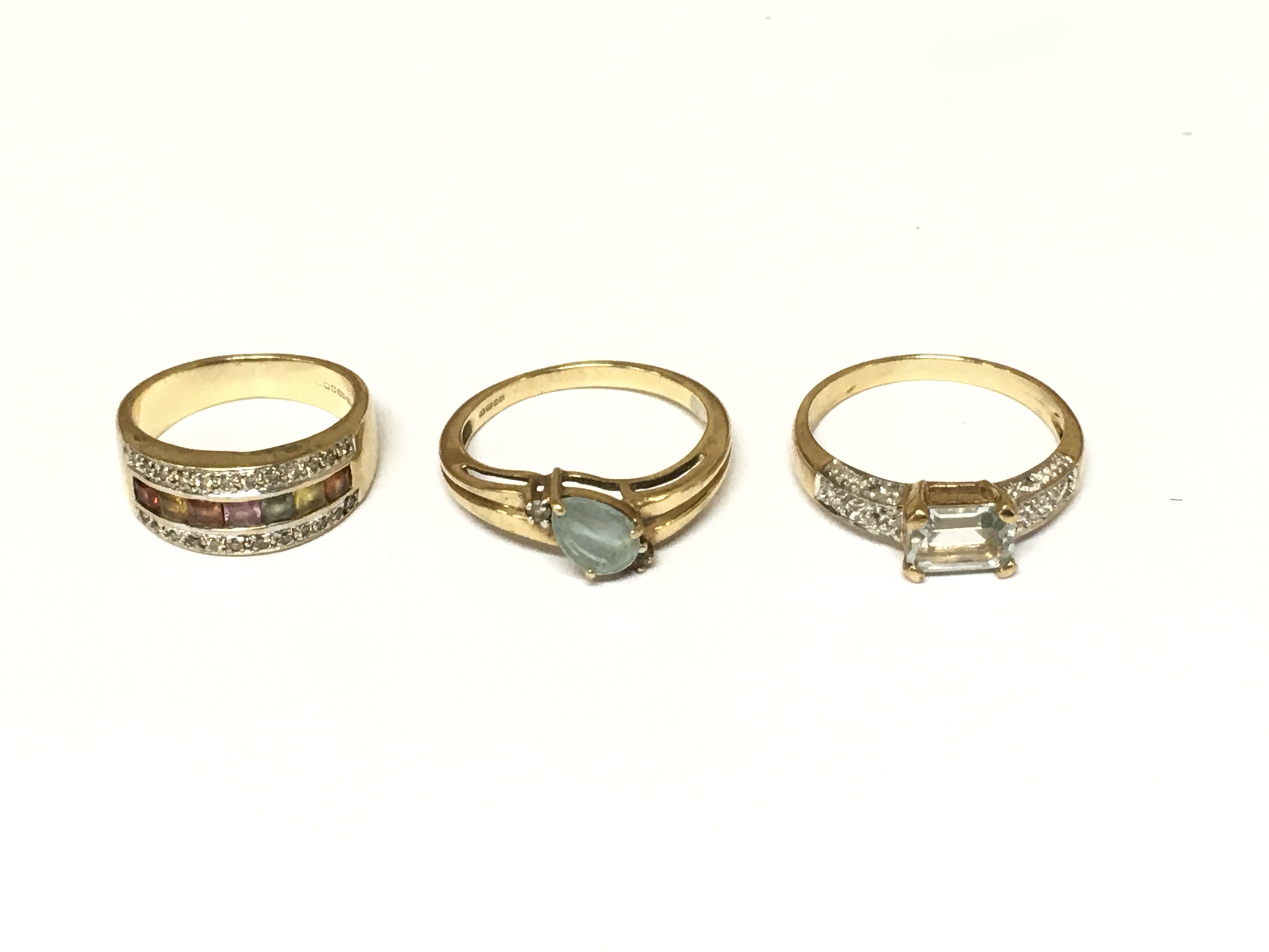 Three 9ct gold cluster rings set with assorted stones. Approximately 8.2g sizes I N and O