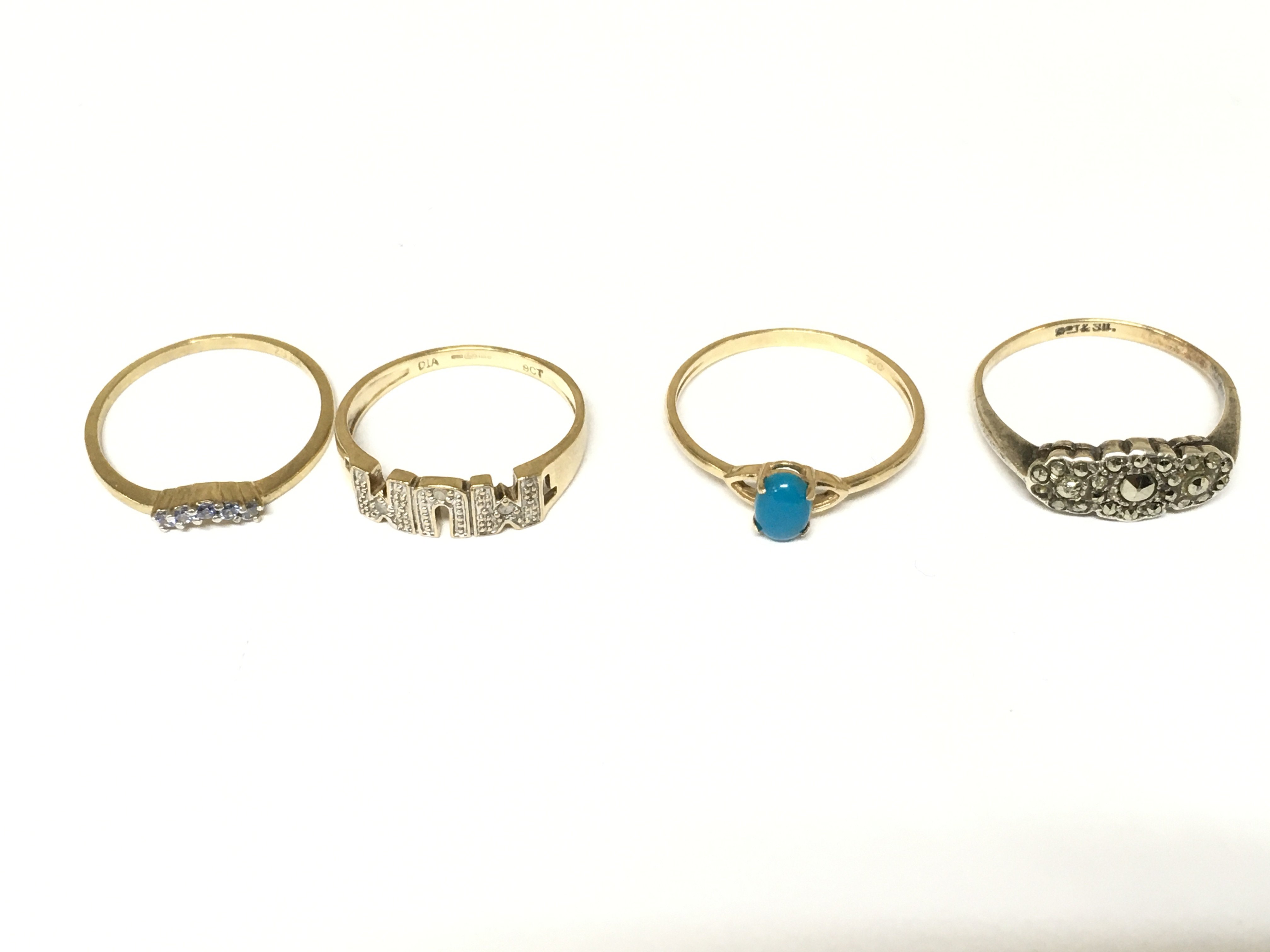 A collective lot of four 9ct gold rings of various styles. Approximately 5.6g sizes N O1/2 P 1/2
