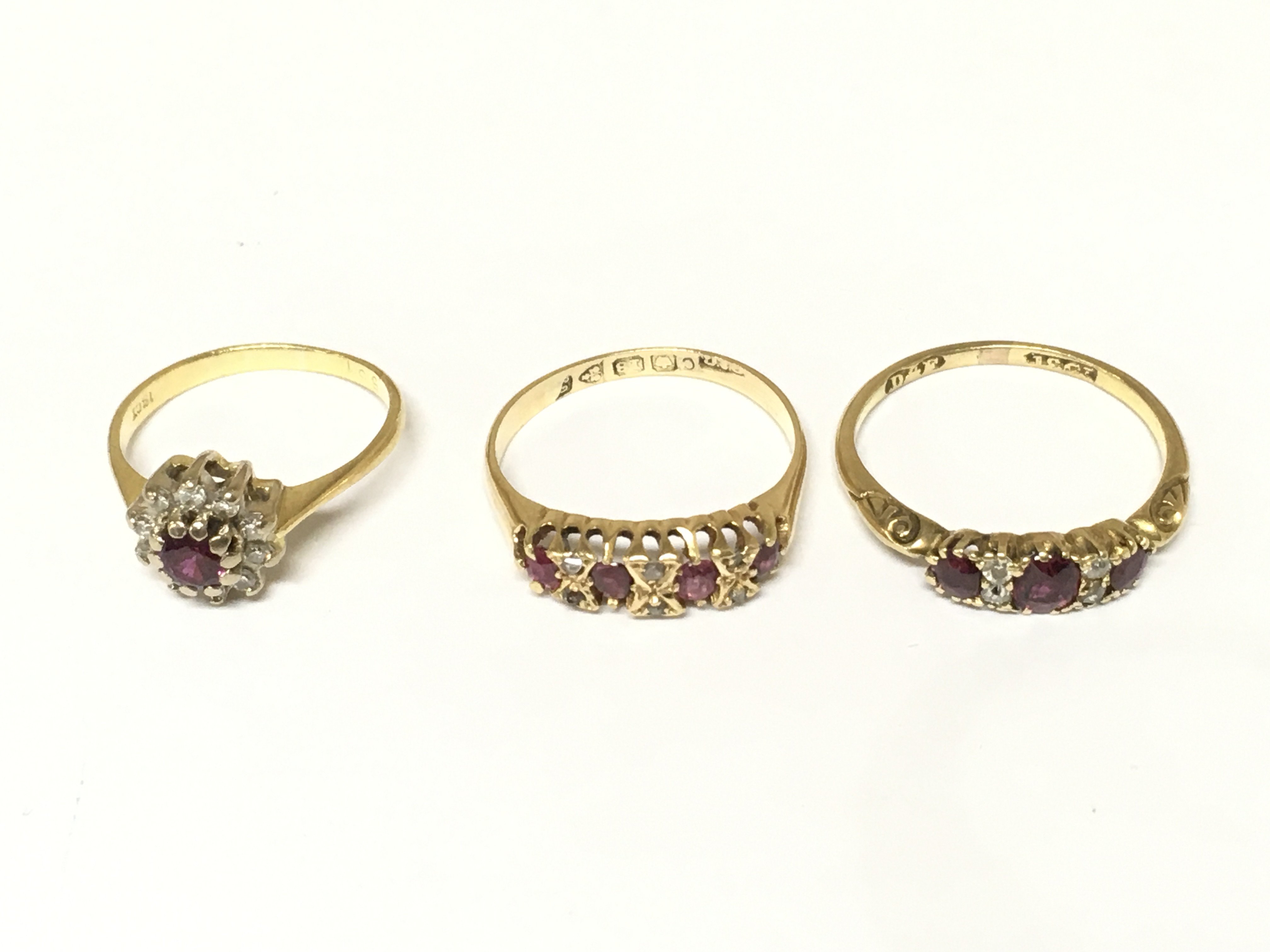 Three 18ct gold ruby and diamond set rings. Approximately 7.2g and sizes J N and O