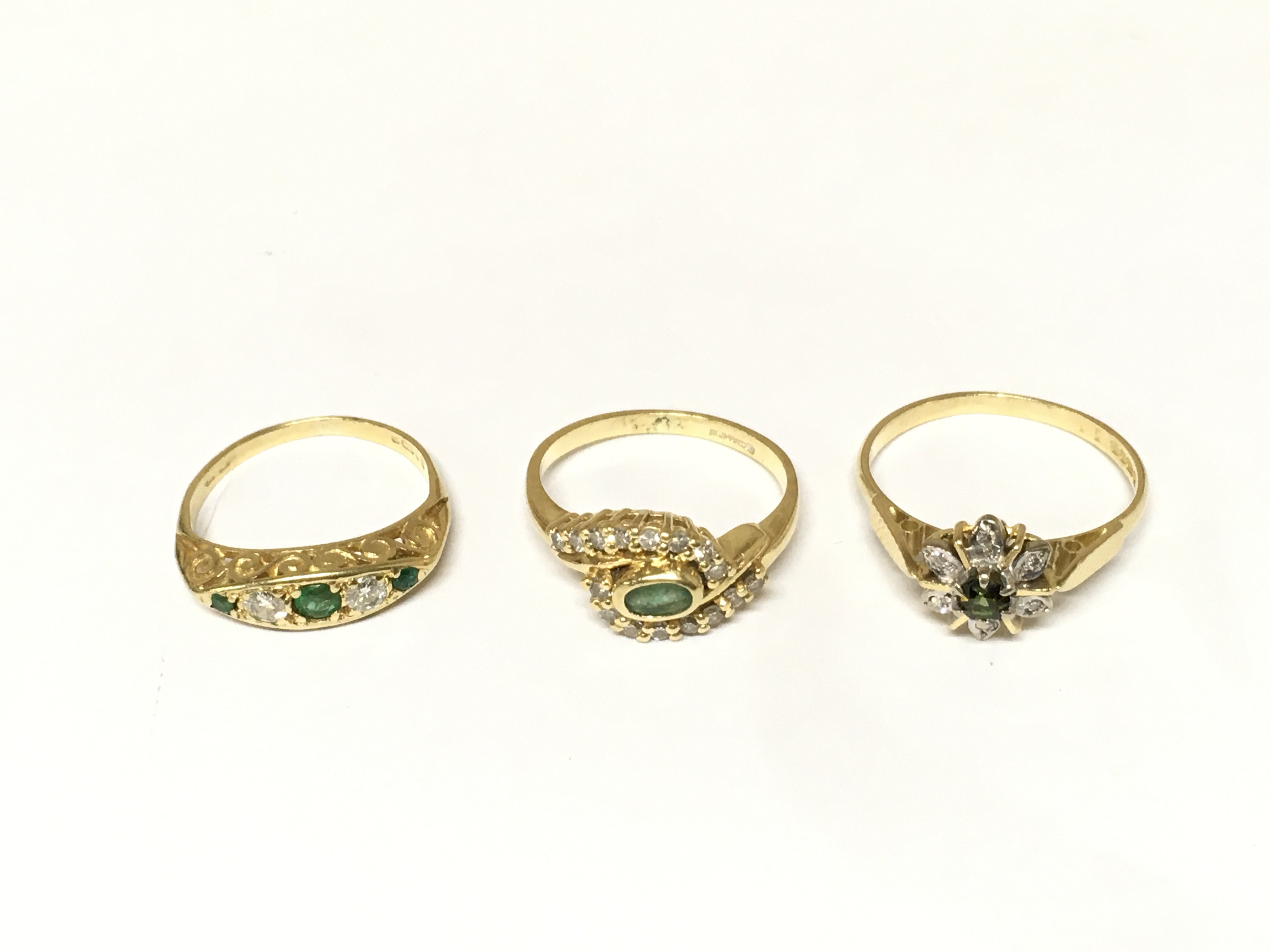 Three 18ct gold rings two set with diamond and emerald and one tourmaline ring. Approximately 8.8g and sizes J and K and P