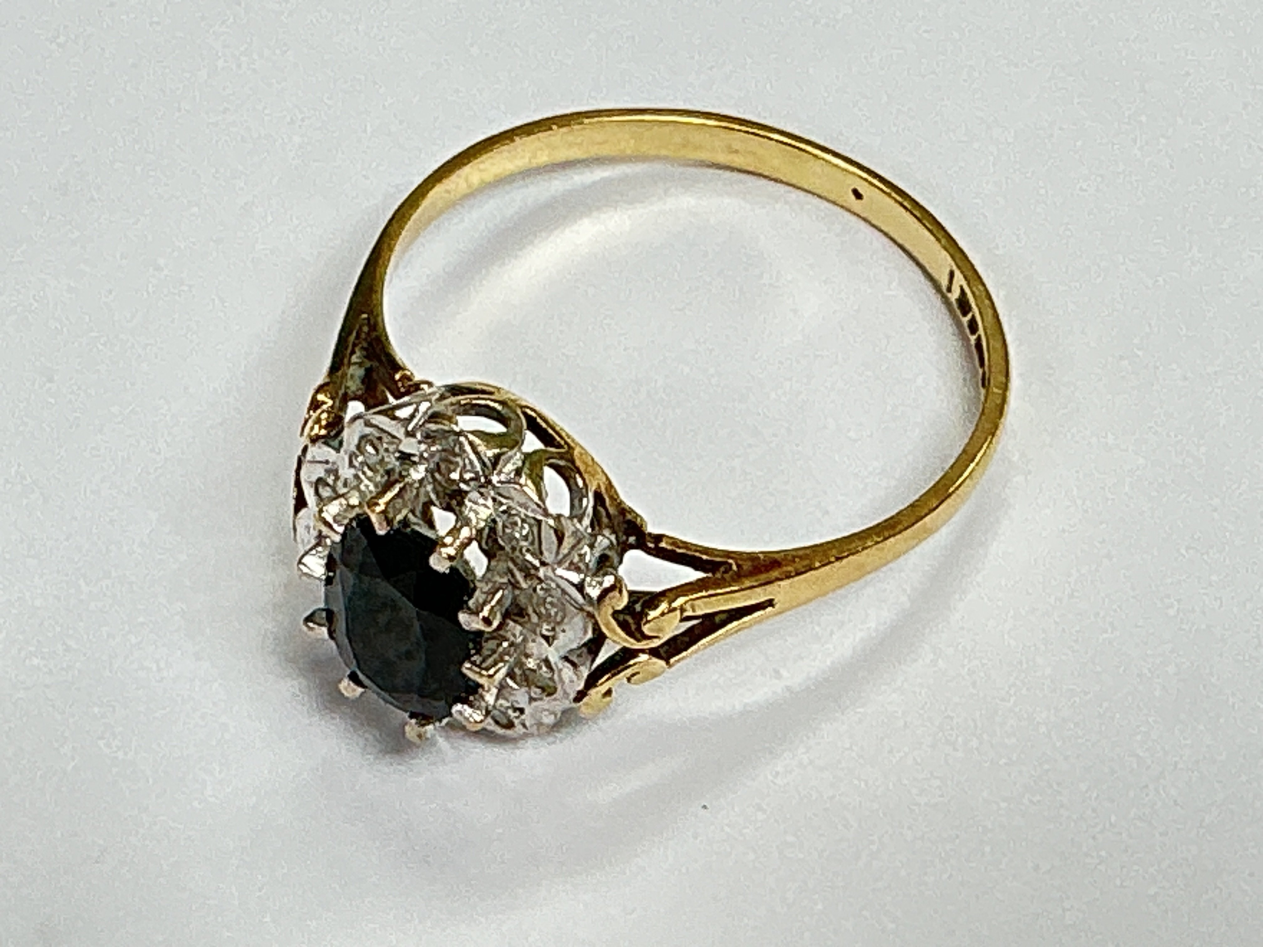 A 9ct gold diamond and sapphire set ring, approx weight 2.13grams. Approx size P.