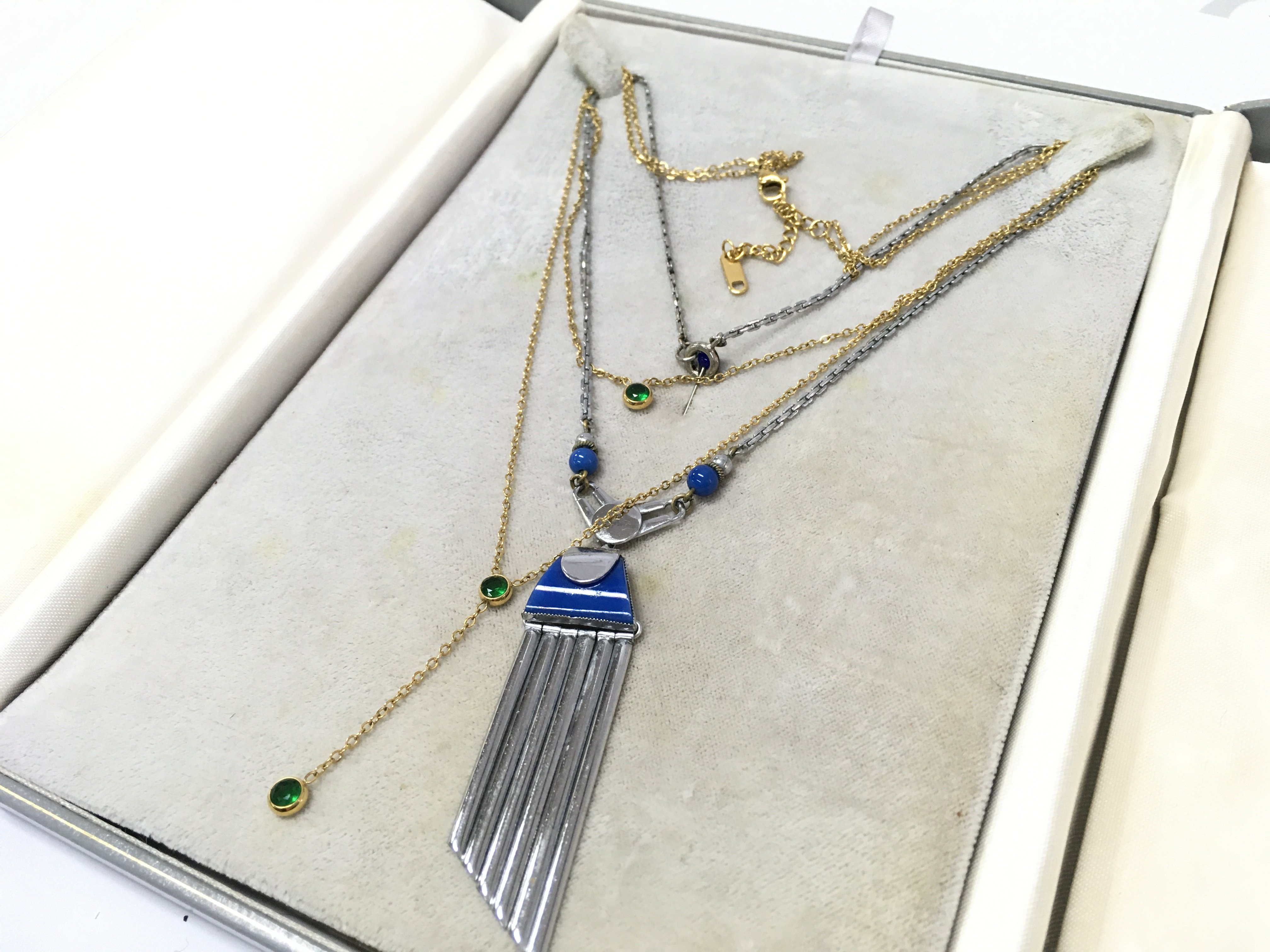 An art deco necklace, Bakerlite and chrome and a 18k gold plated necklace . Postage category B