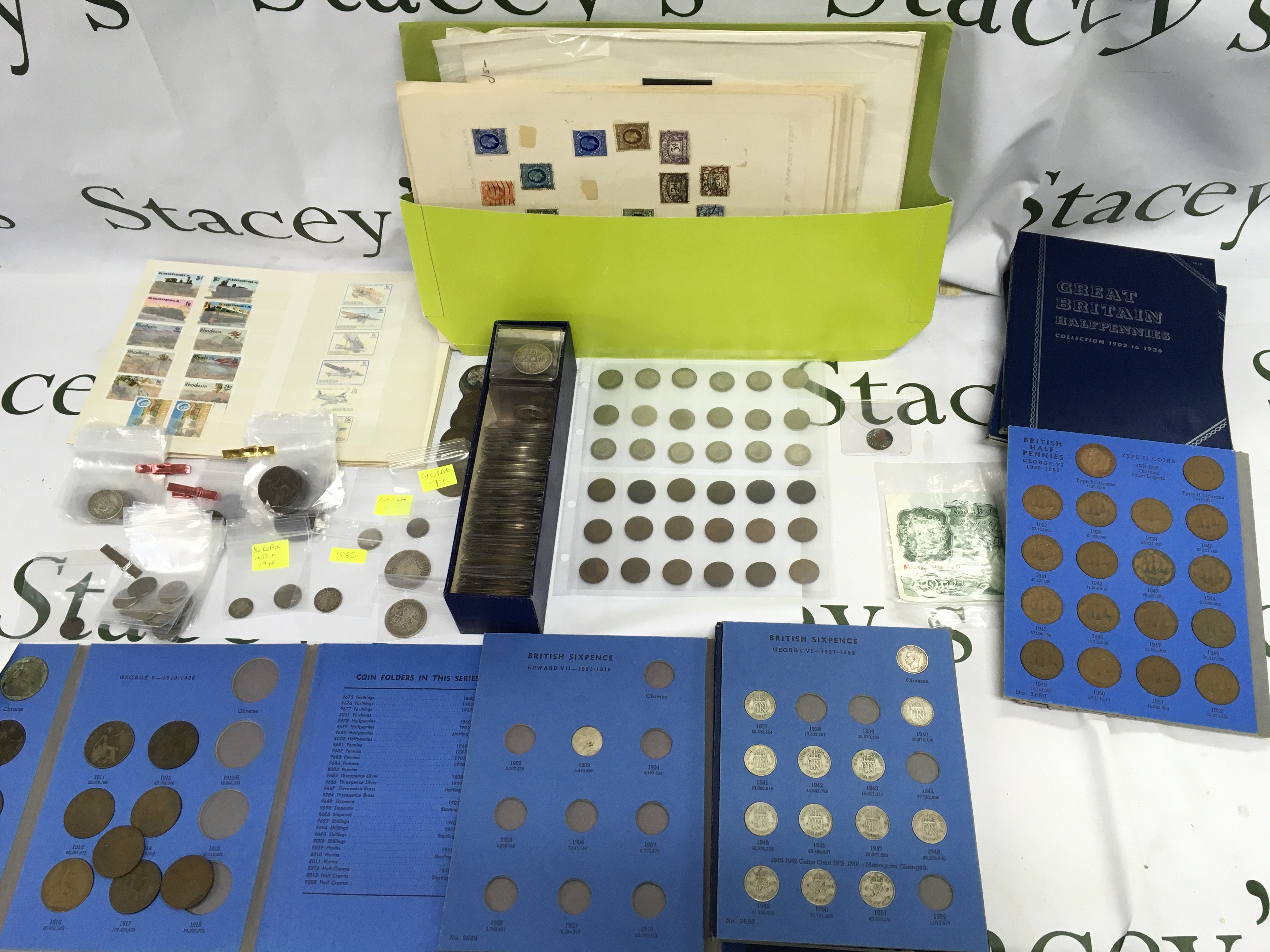 A collection of stamps and coinage including pre 1946 silver examples.