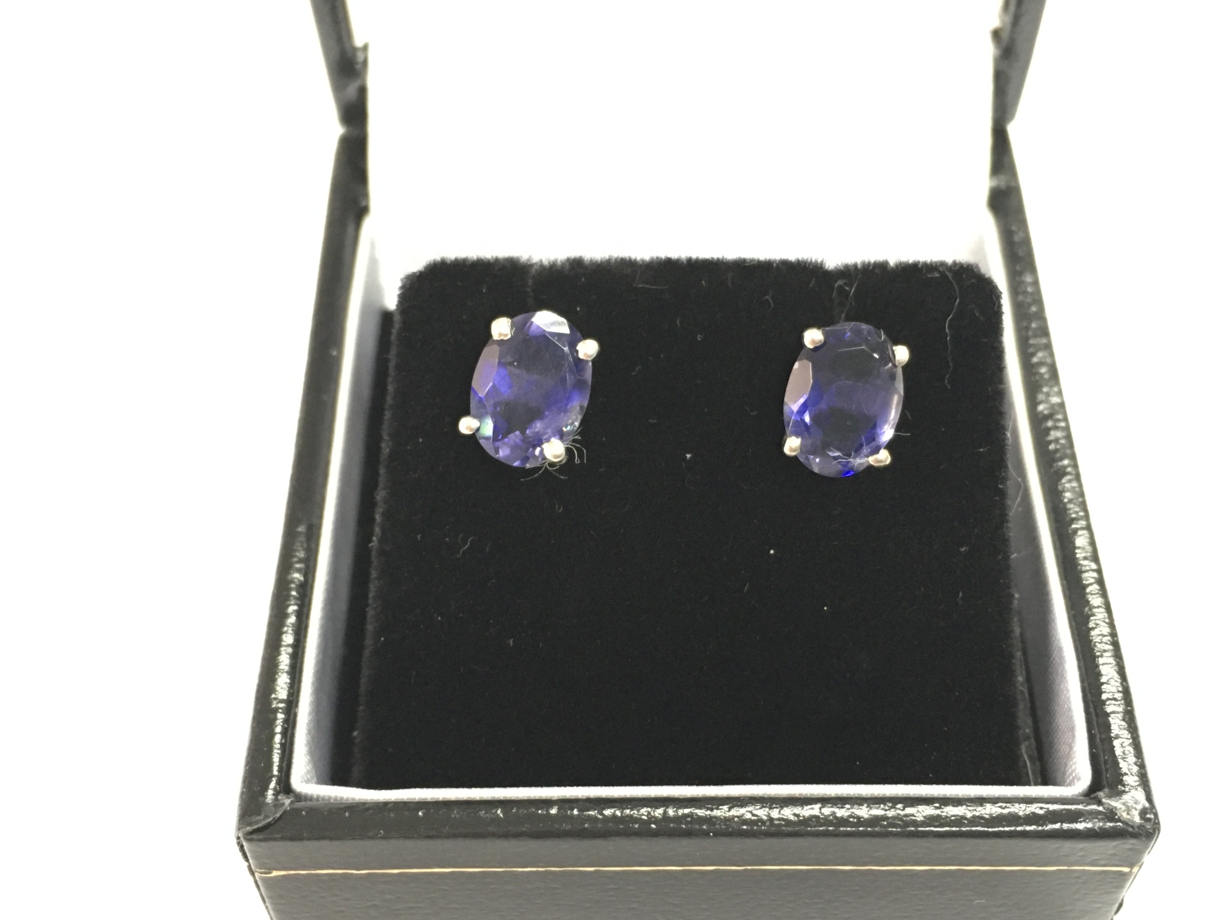 A pair of Iolite studs in silver with box. Postage B