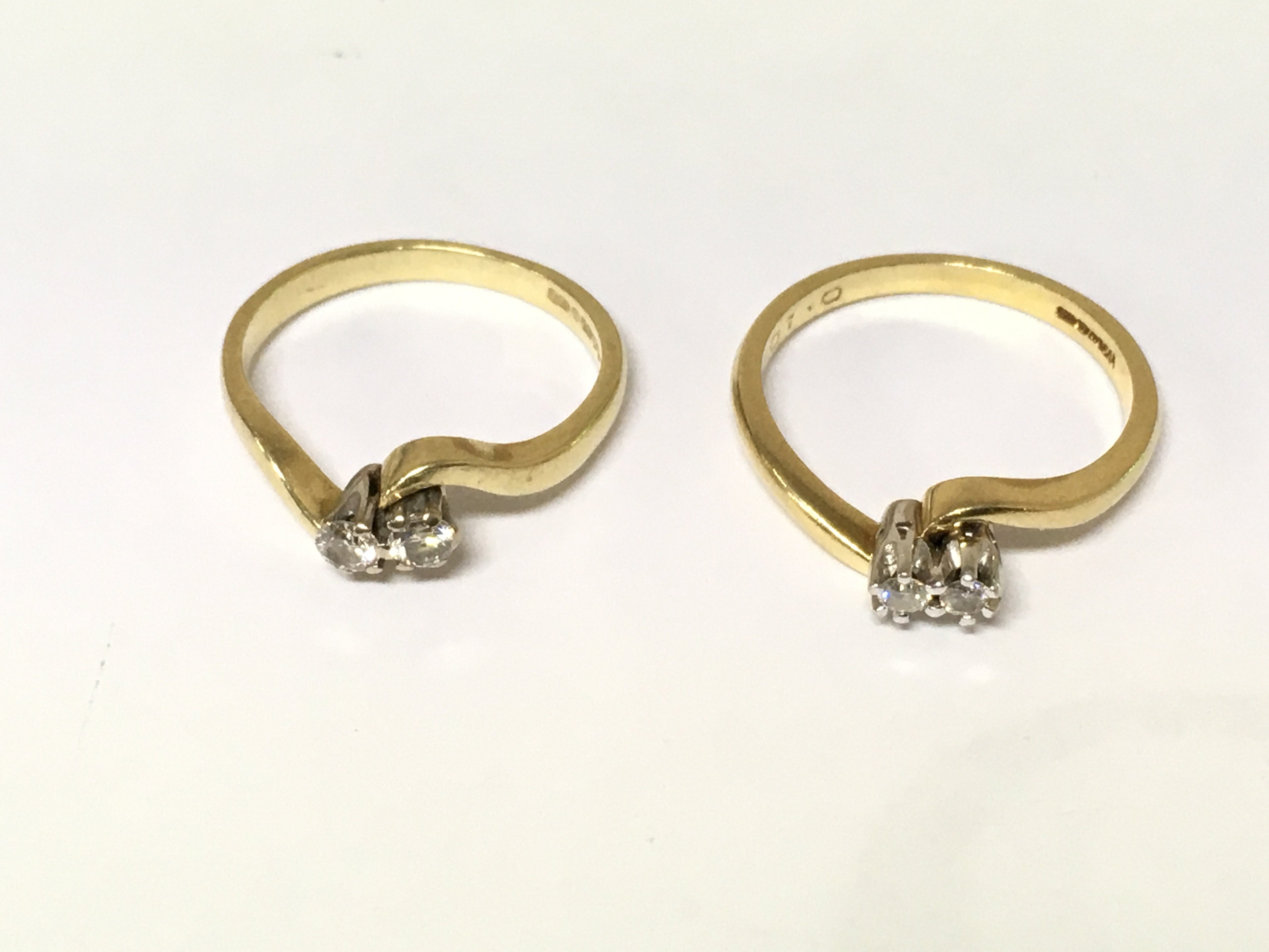 Two 18ct gold 2 stone diamond rings. Approximately 7g and sizes N and P