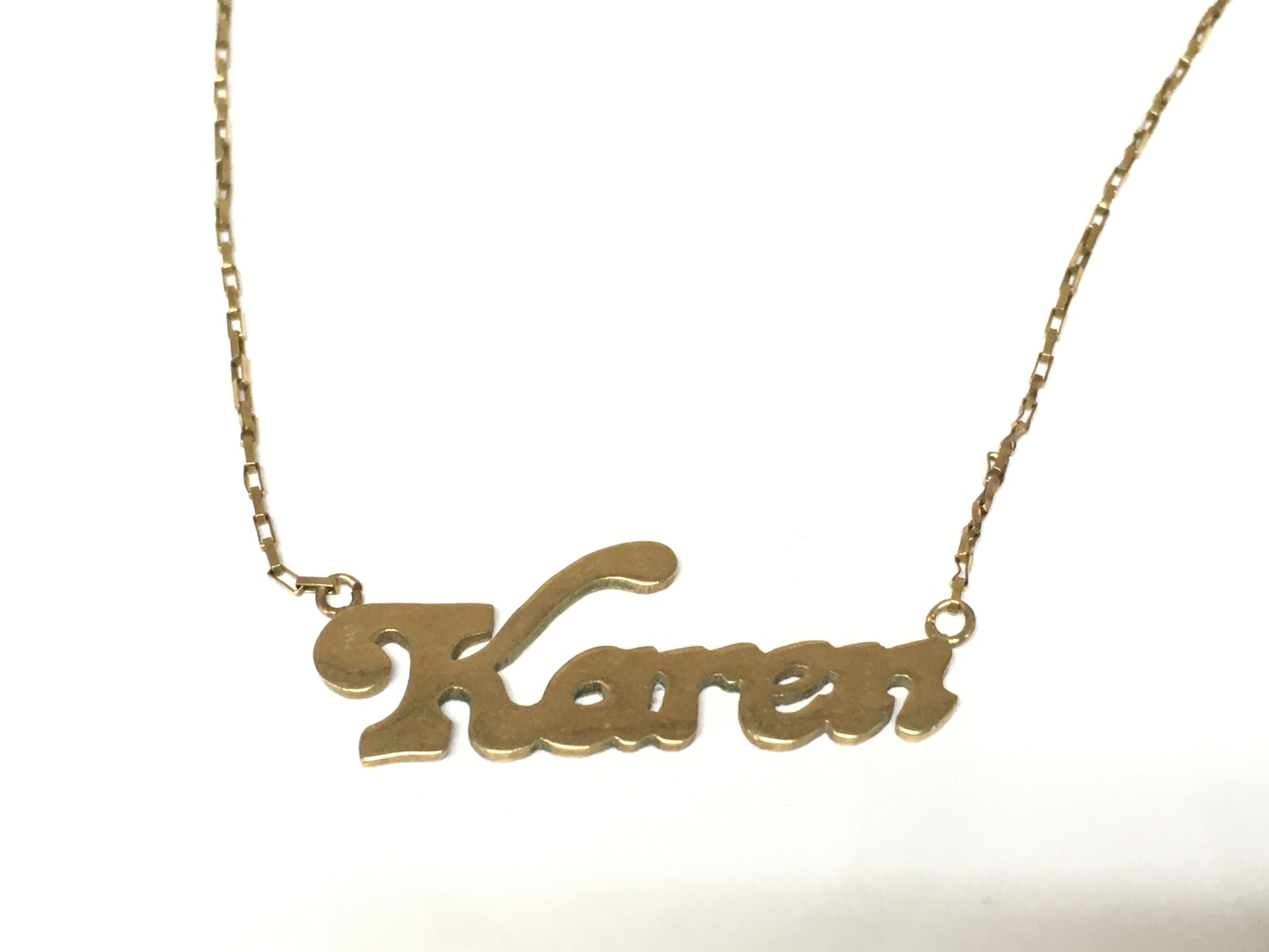 A 9ct gold Karen necklace. 4.3g Postage A