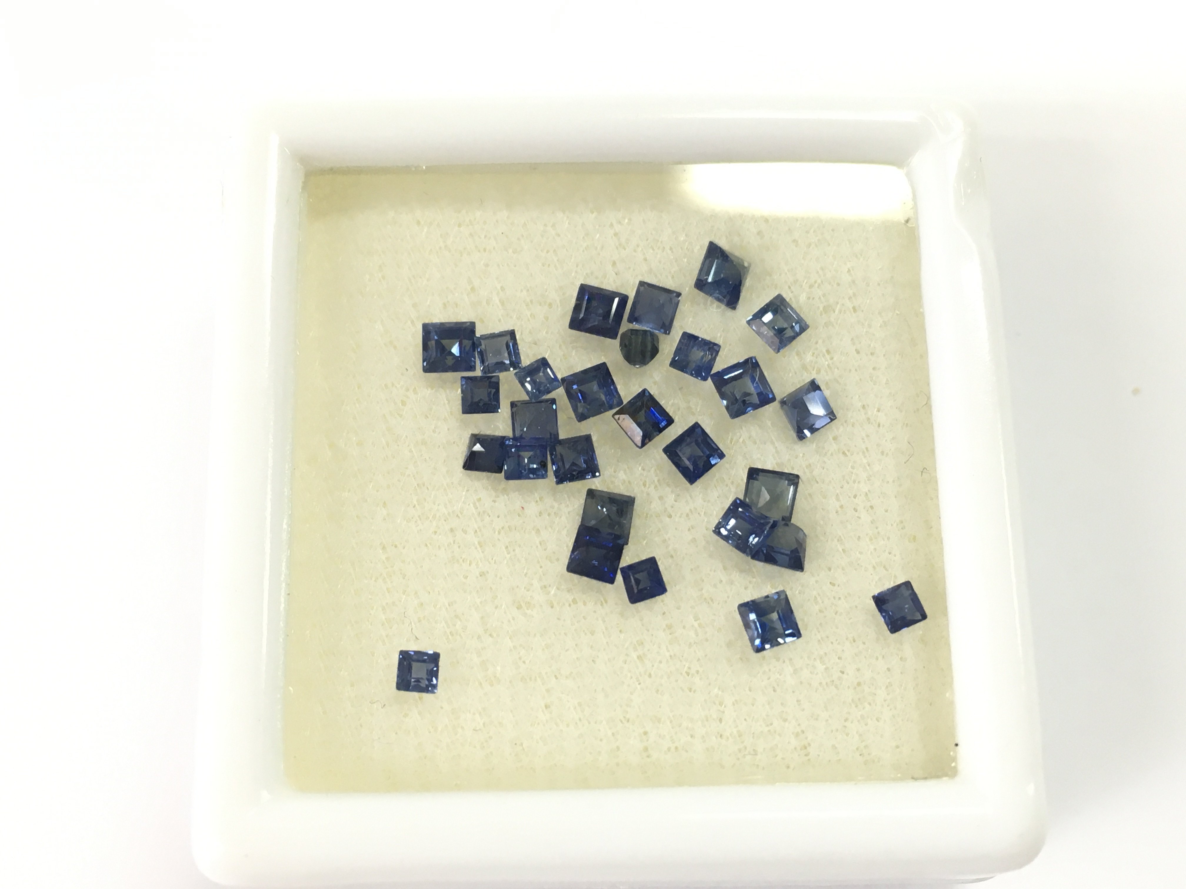 28 lose square and step cut sapphires. Total 2.75ct. Postage B