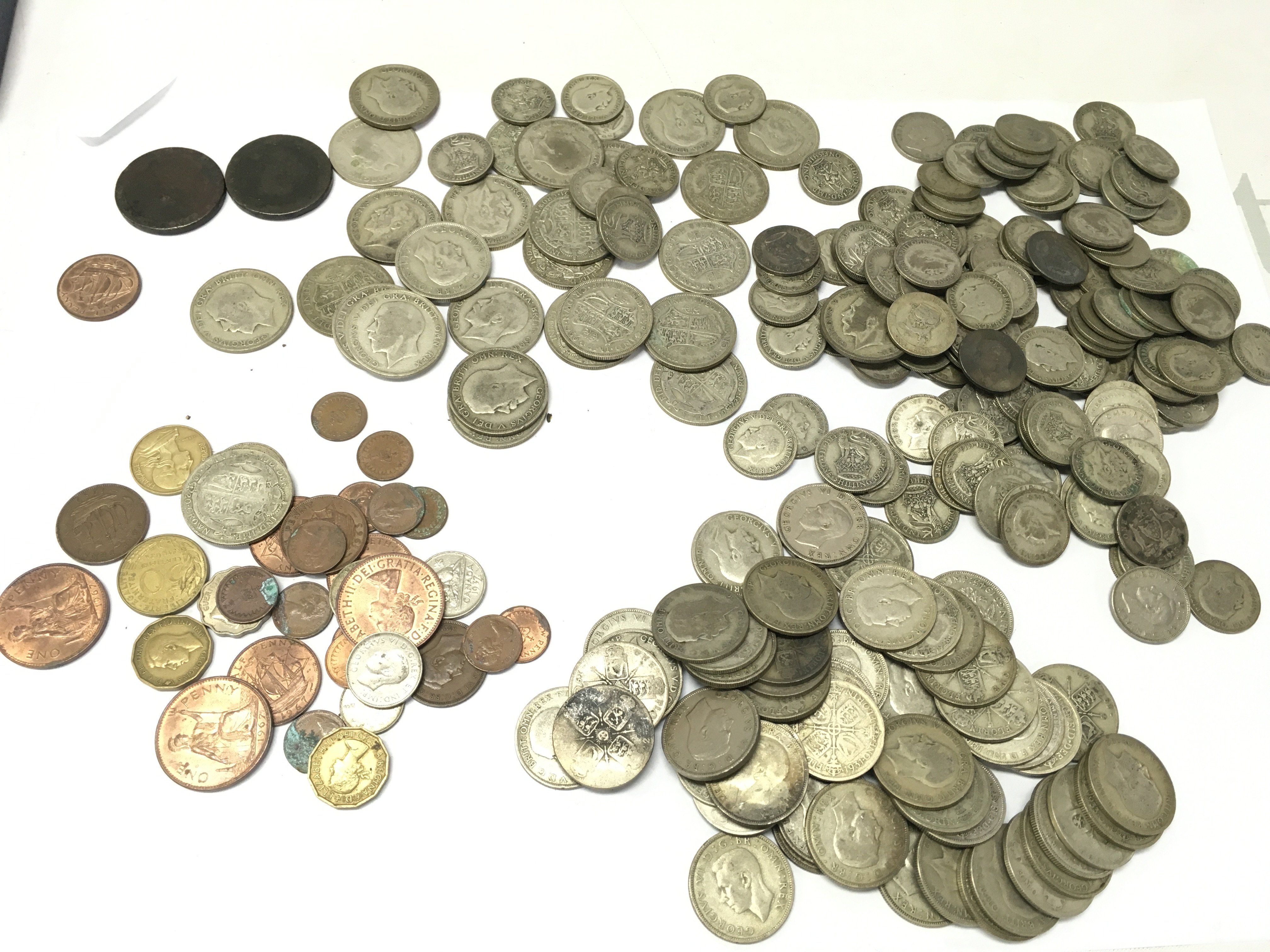 A collection of GB coinage including Florins, Shillings, Half Crowns , King George III cartwheel pennies etc. postage category A