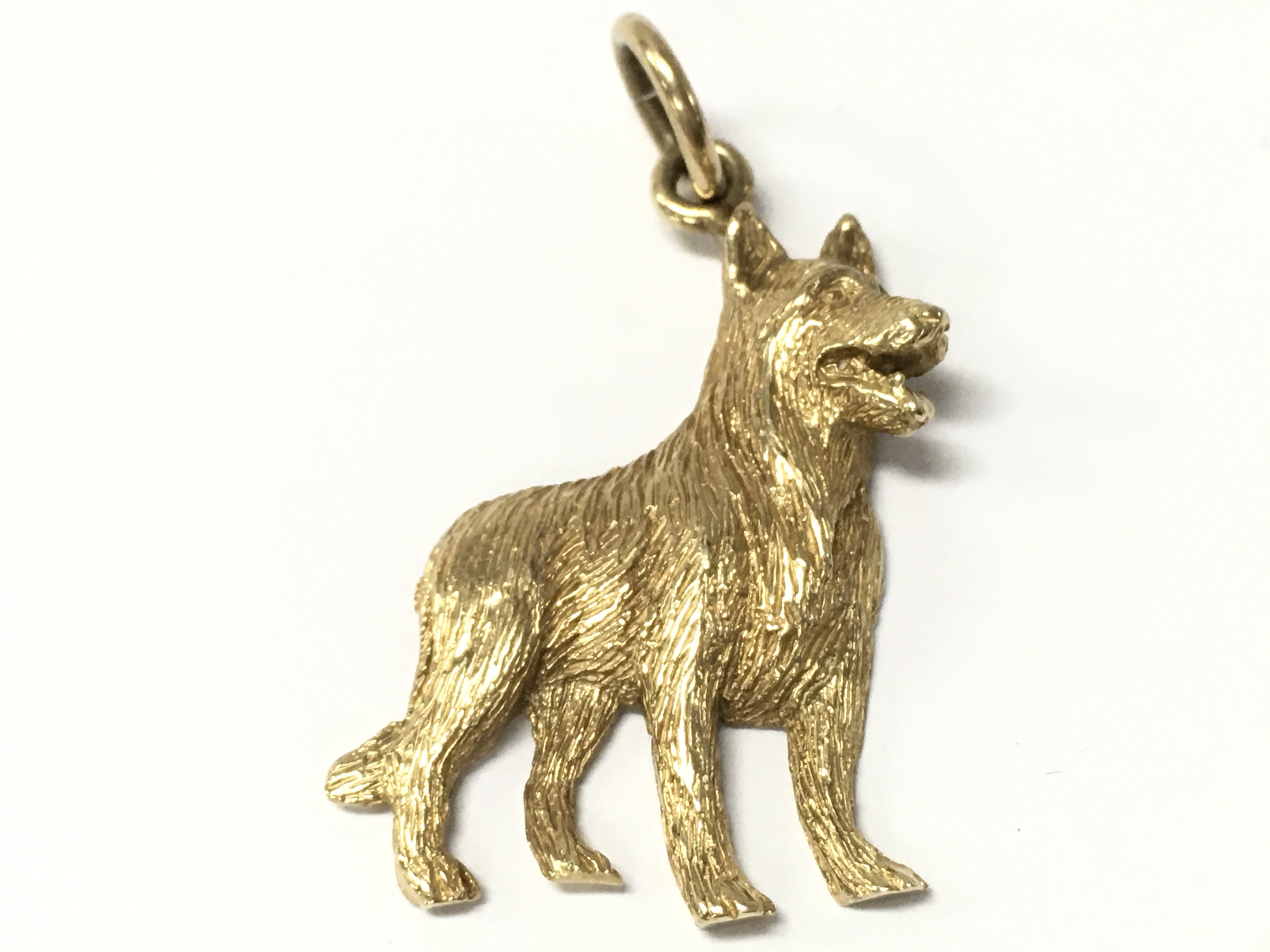 A 9ct gold dog pendant , 6.1g total weight. Postage catA