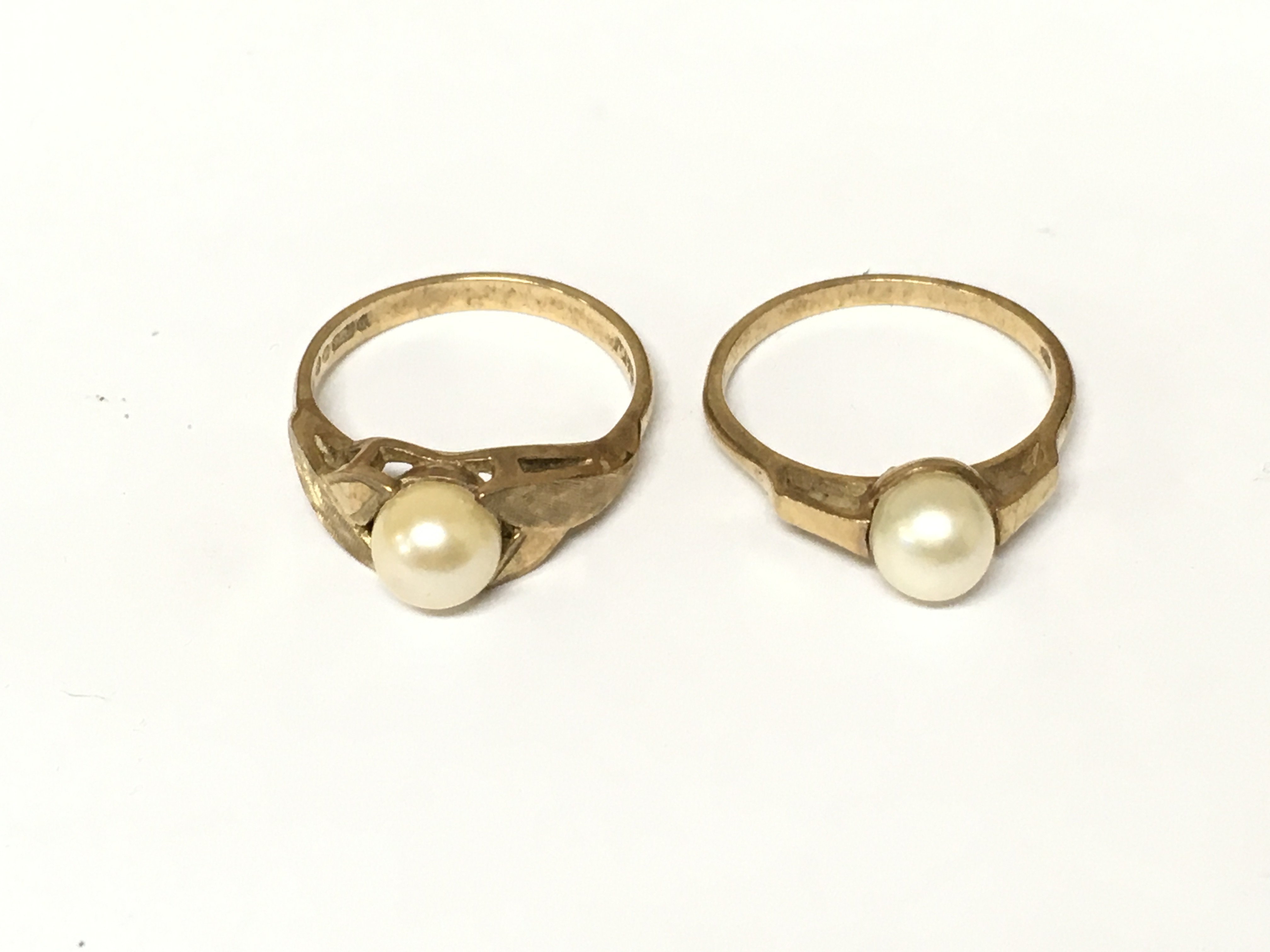 Two 9ct gold rings set with pearl. Approximately 4.57g size L 1/2 and M 1/2