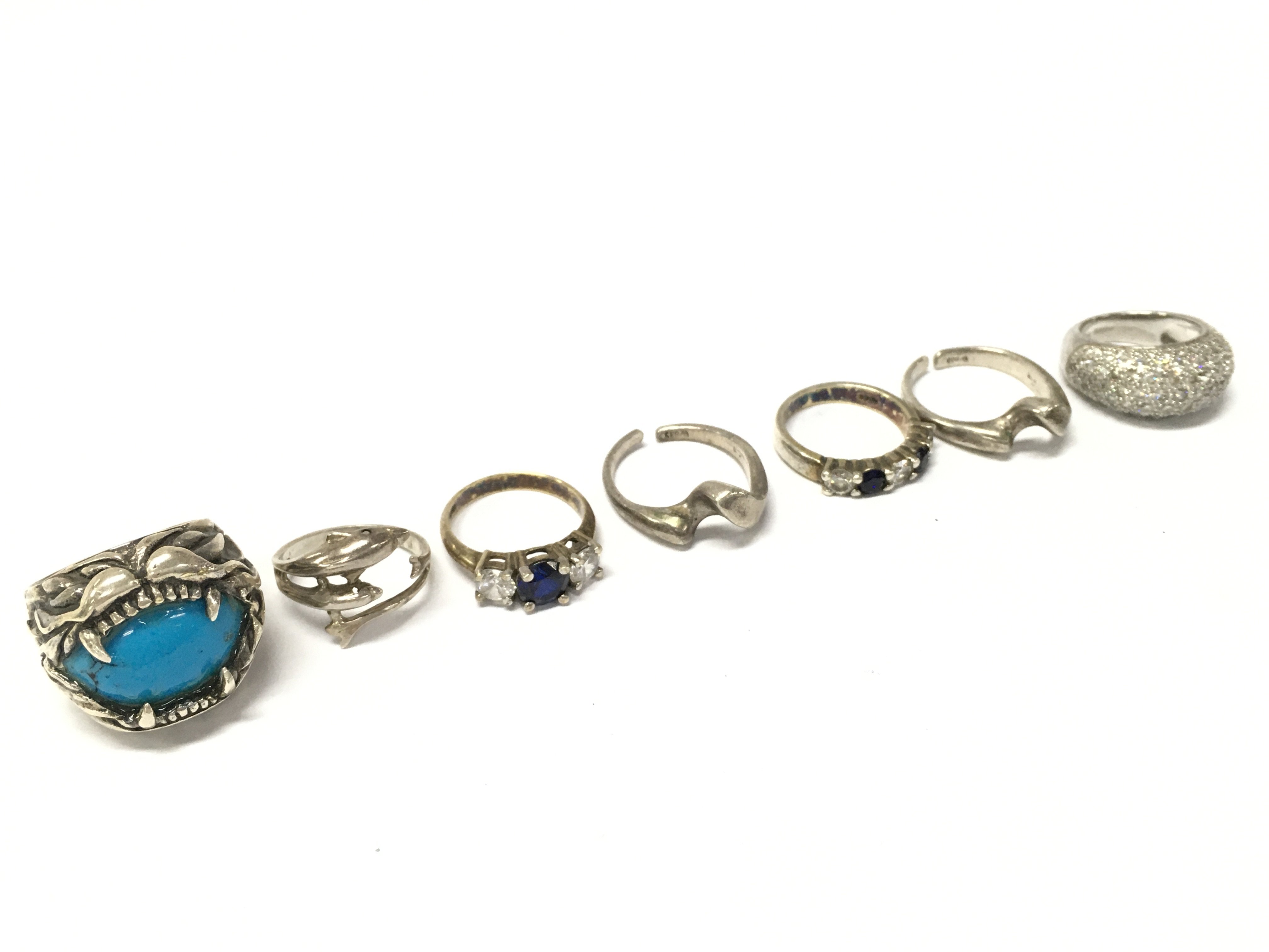 WITHDRAWN - Six silver rings including Turquoise , CZ rings etc. various sizes. Postage cat A