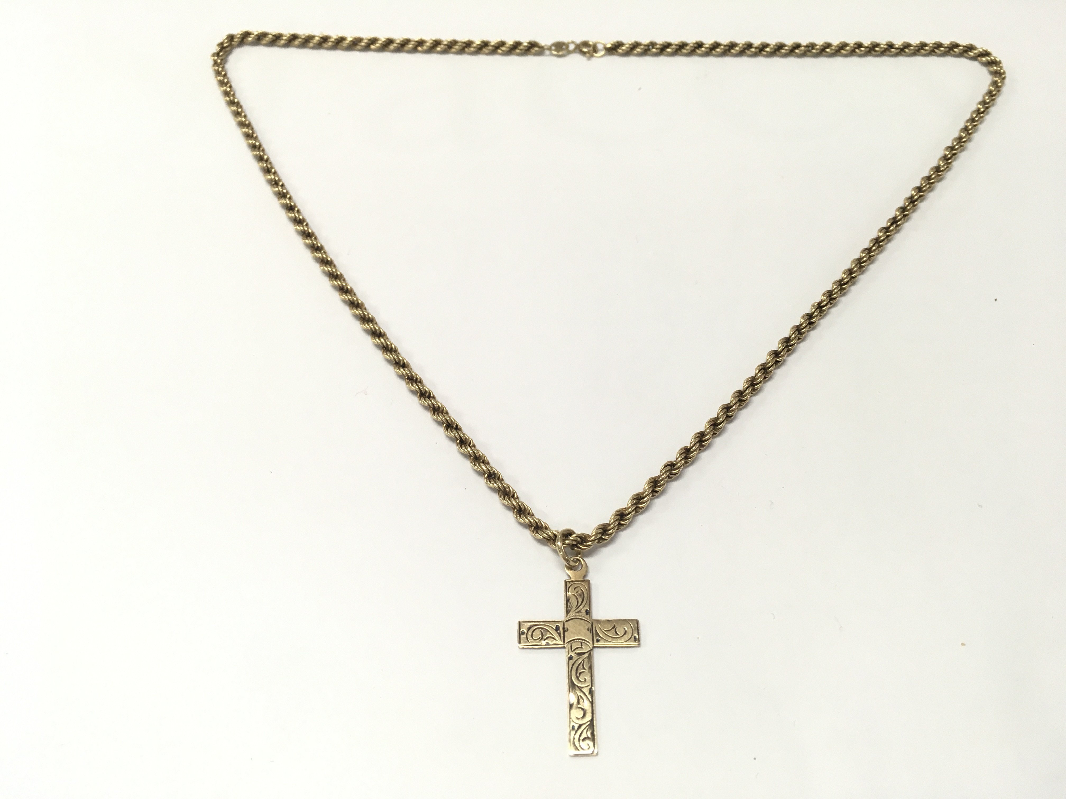 A gold chain with cross pendant . Total weight 6.1g . Postage category A