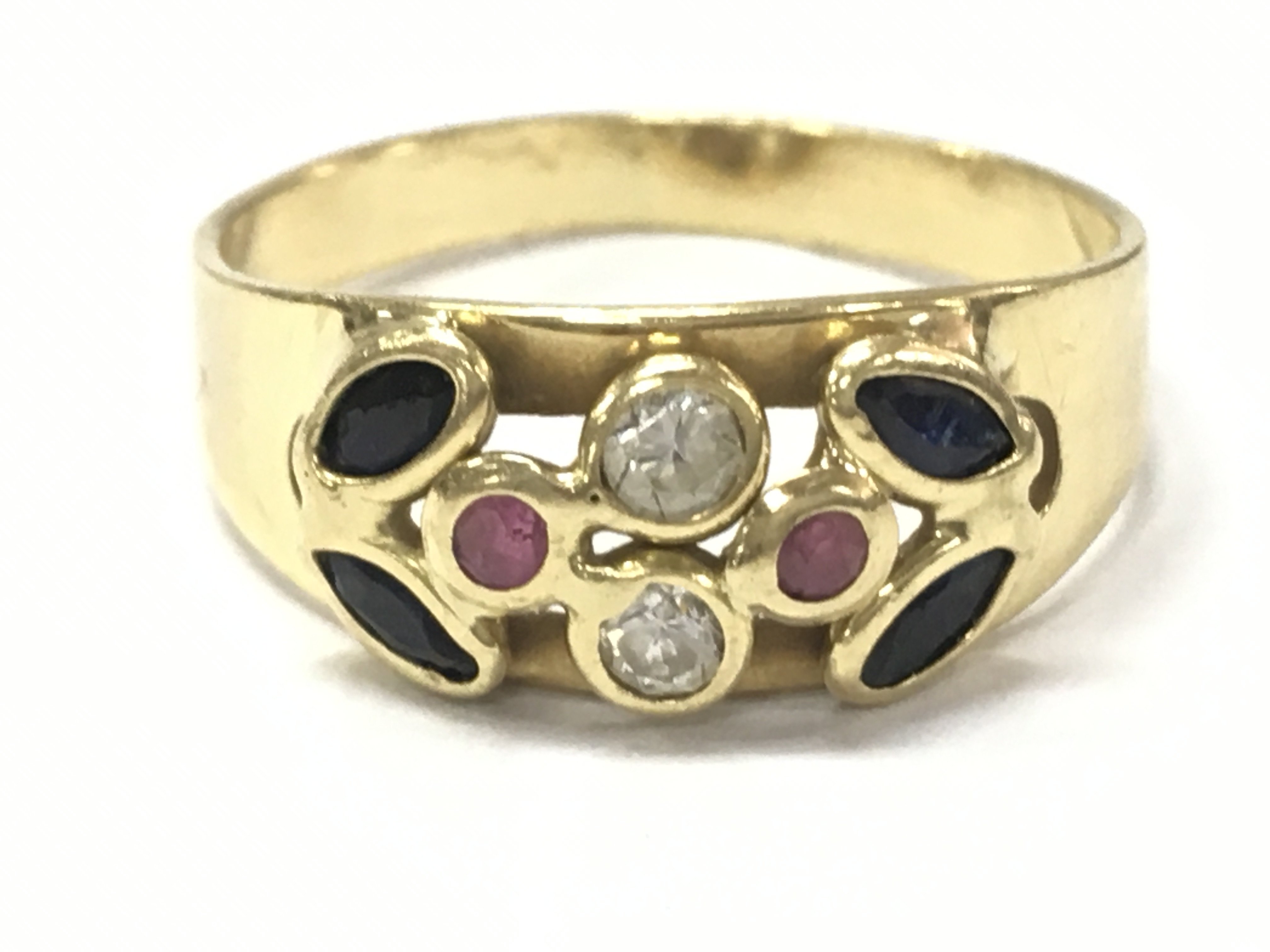 An 18ct gold multi gem stone ring, 2.9g total weight. Size Q. Postage category A