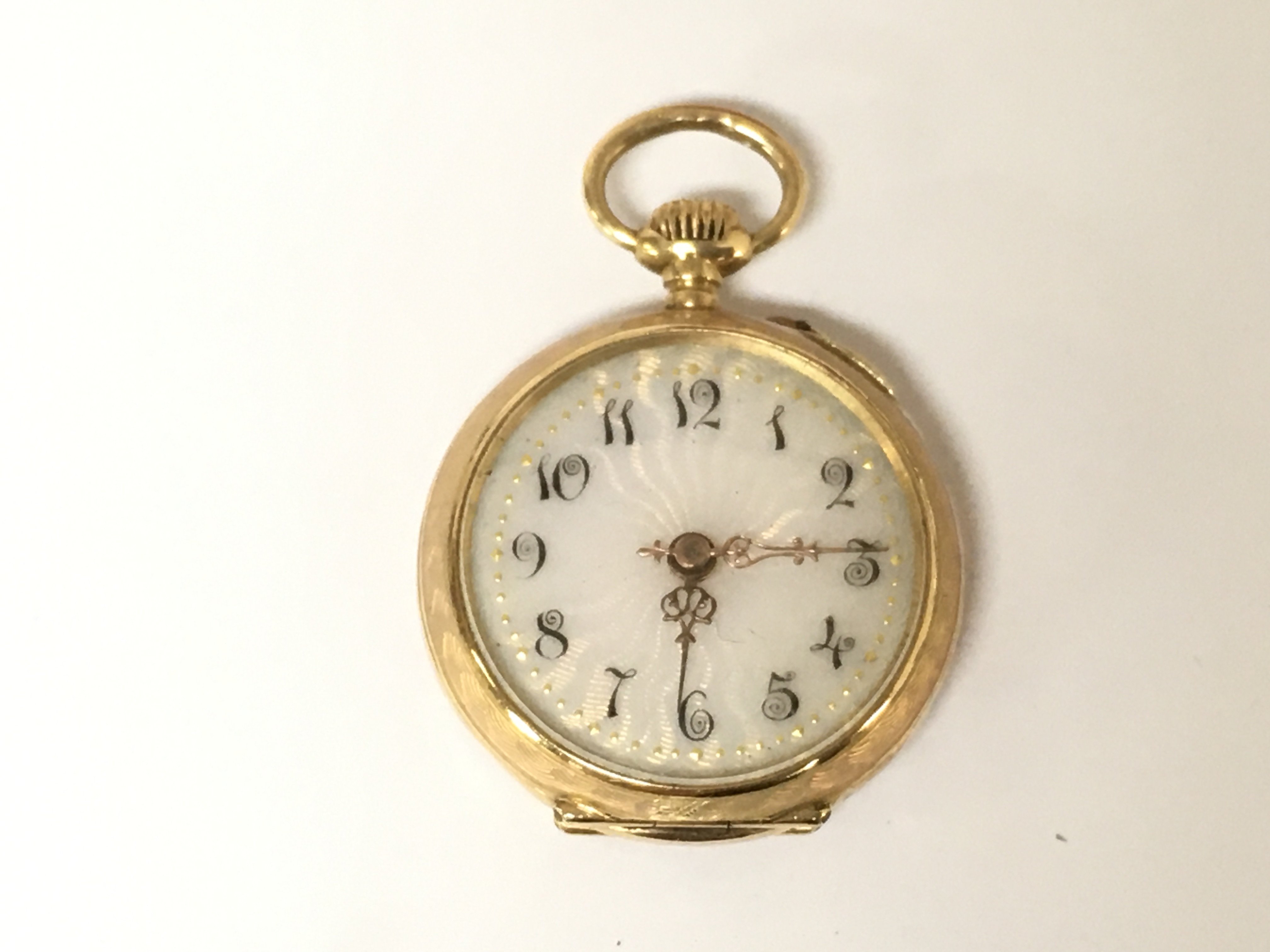 A ladies 18ct gold fob watch with enamel back. Winds and runs but not tested for time keeping. 16.31g
