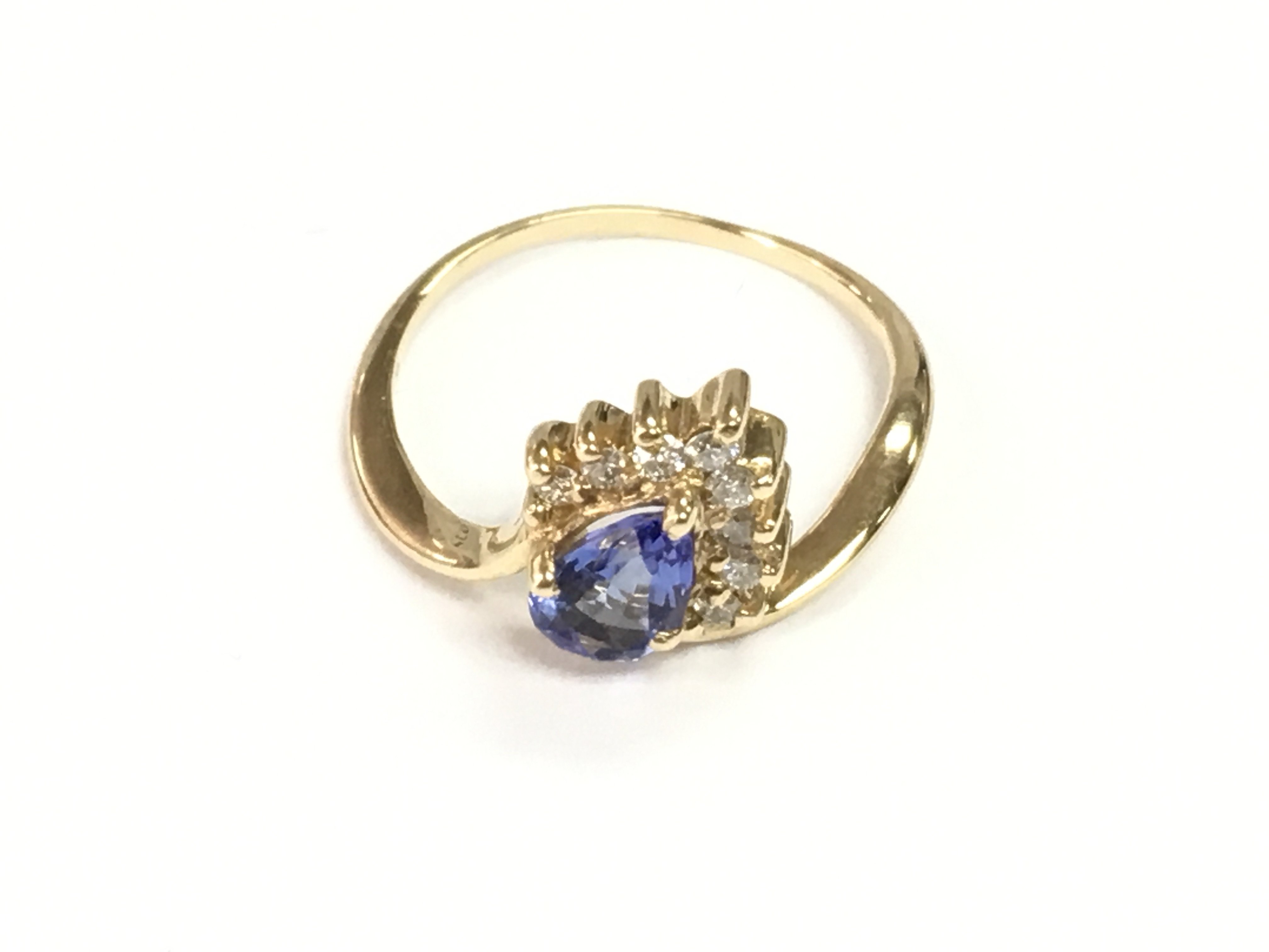 14ct gold dress ring set with pear shaped tanzanite and diamonds. Tanzanite 0.50ct and diamonds 0.20ct Approx. Size O 1/2.