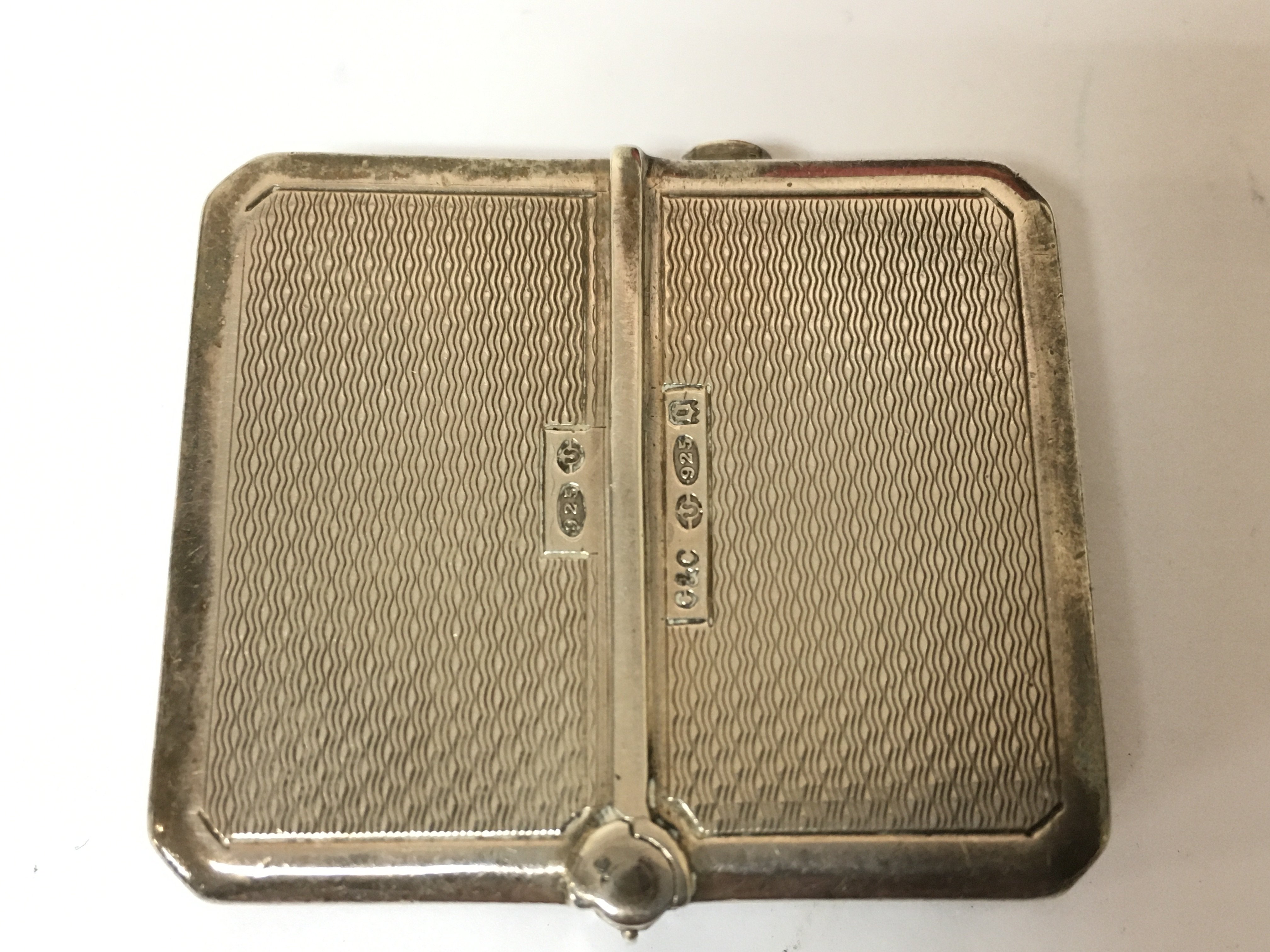 A hallmarked silver travel watch. 46g Postage A