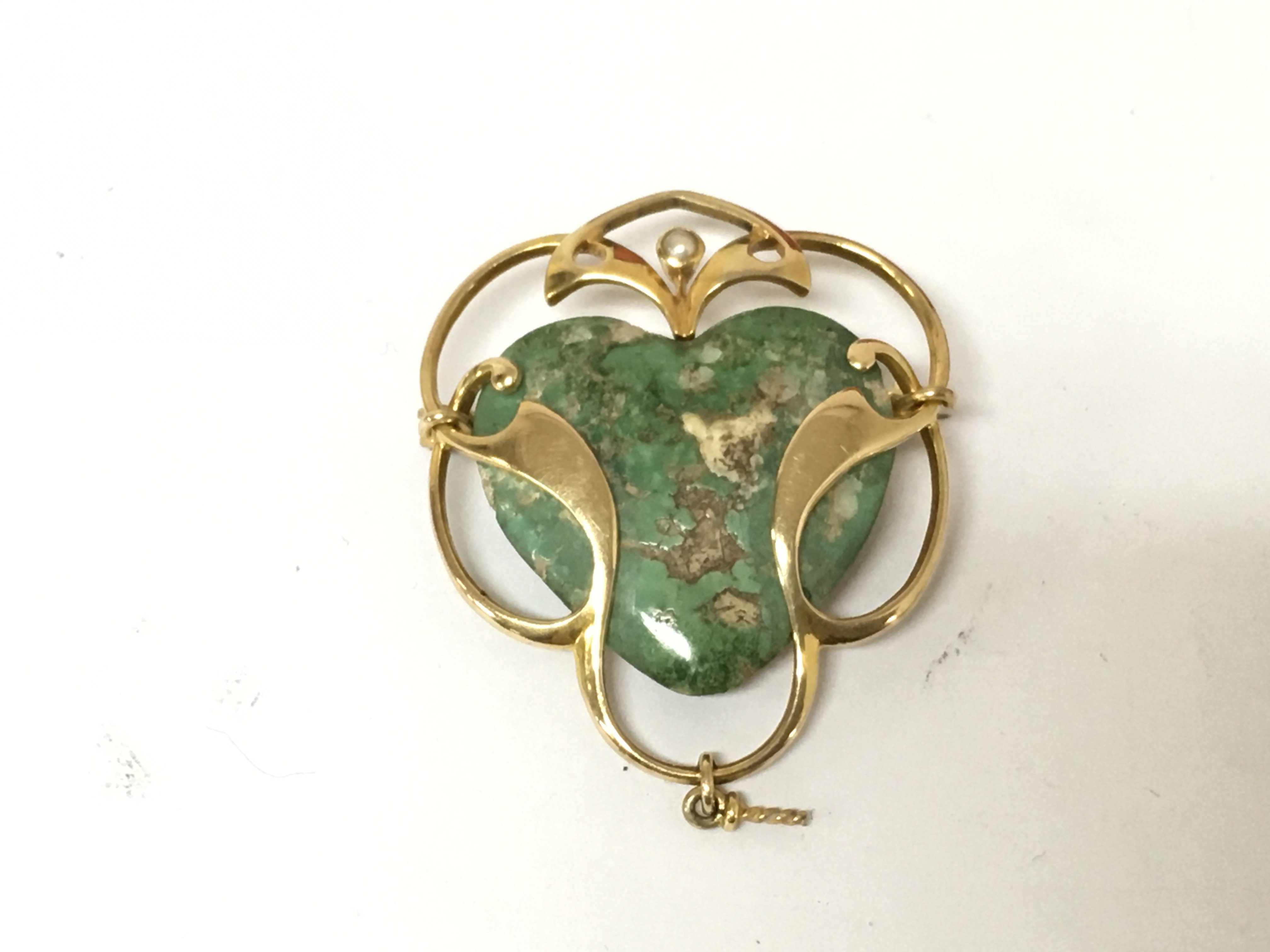 An art nouveau yellow metal and turquoise brooch with a seed Pearl. 7.63g