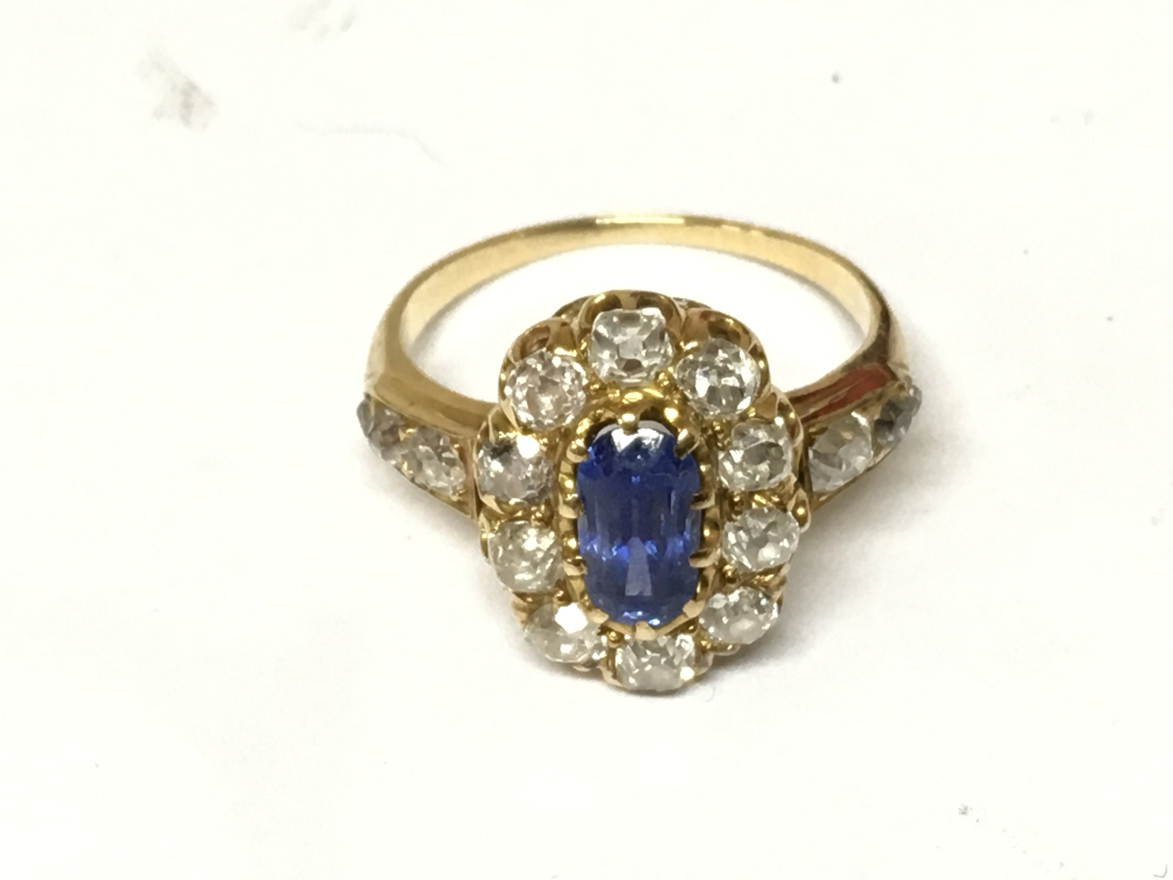 An unmarked sapphire and diamond ring. Size M 1/2 and 3.96g