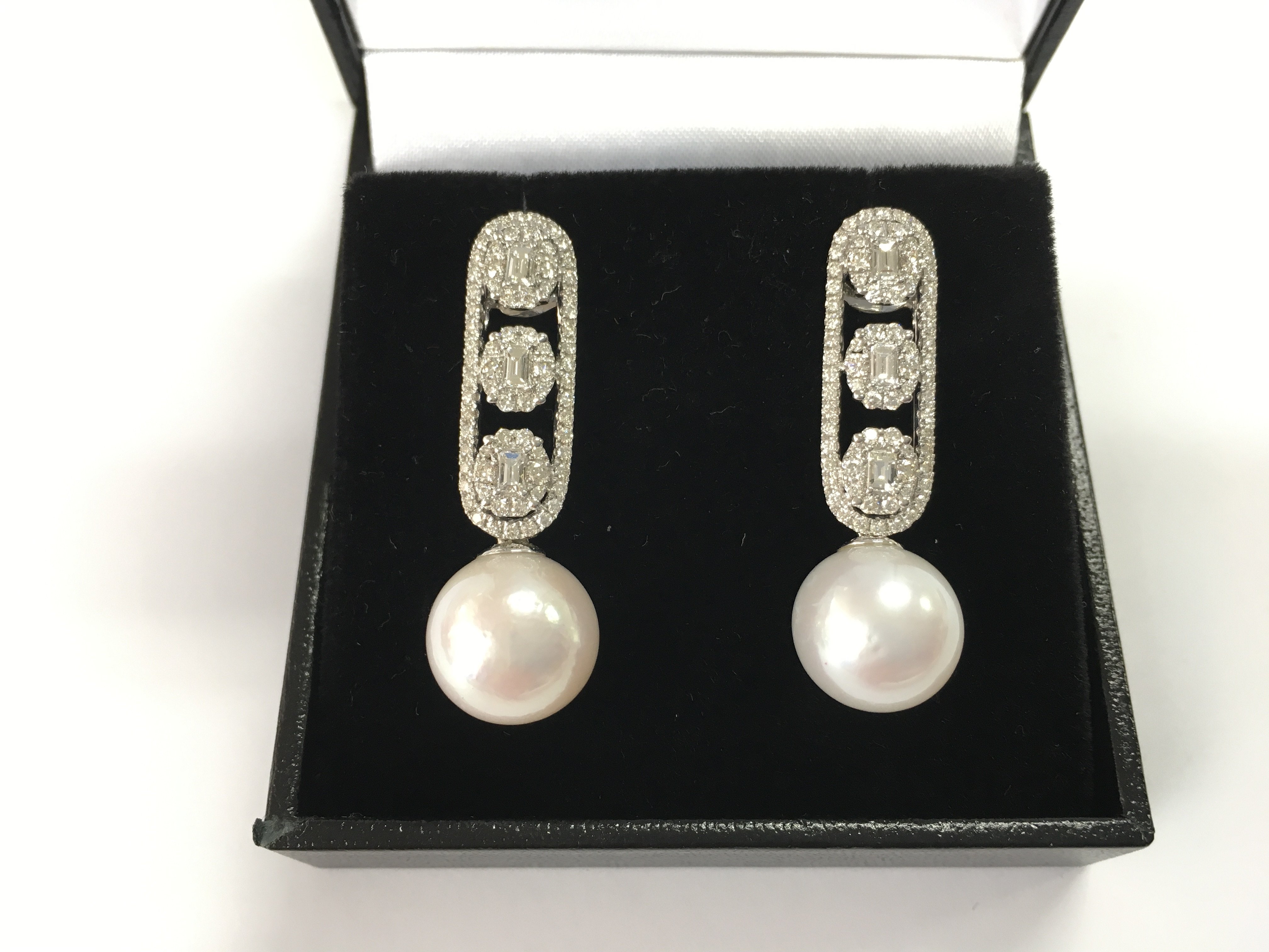 A pair of 18ct white gold long drop deco-style earrings set with cultured pearls and diamonds. Diamonds 1.28ct.