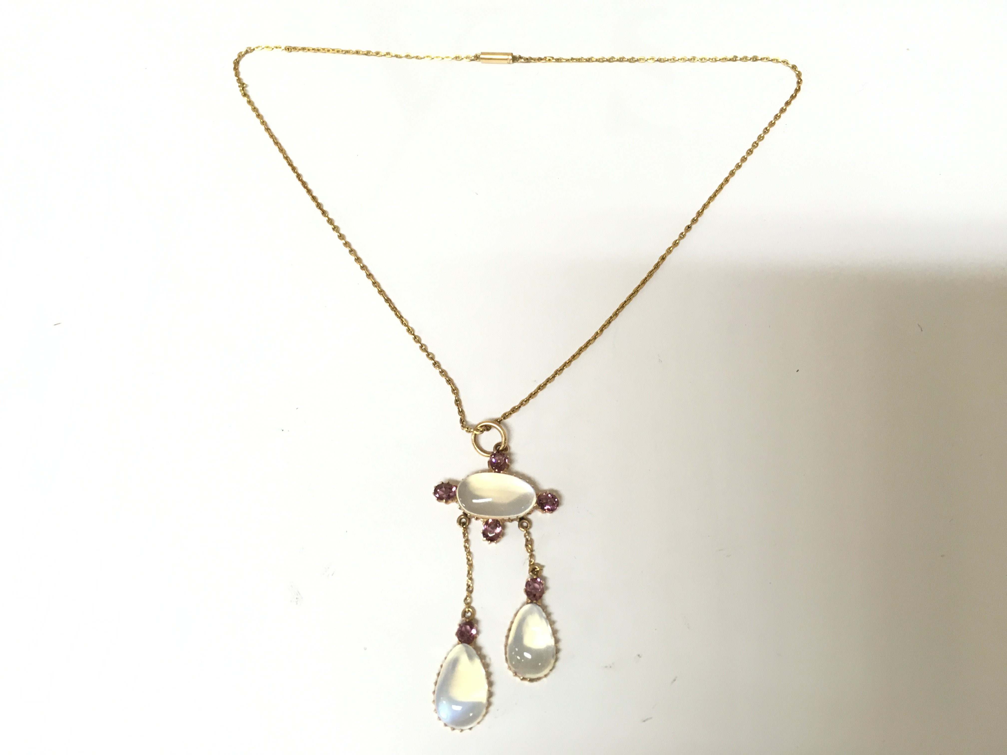 A 15ct amethyst and moonstone pendant necklace. 7.79g