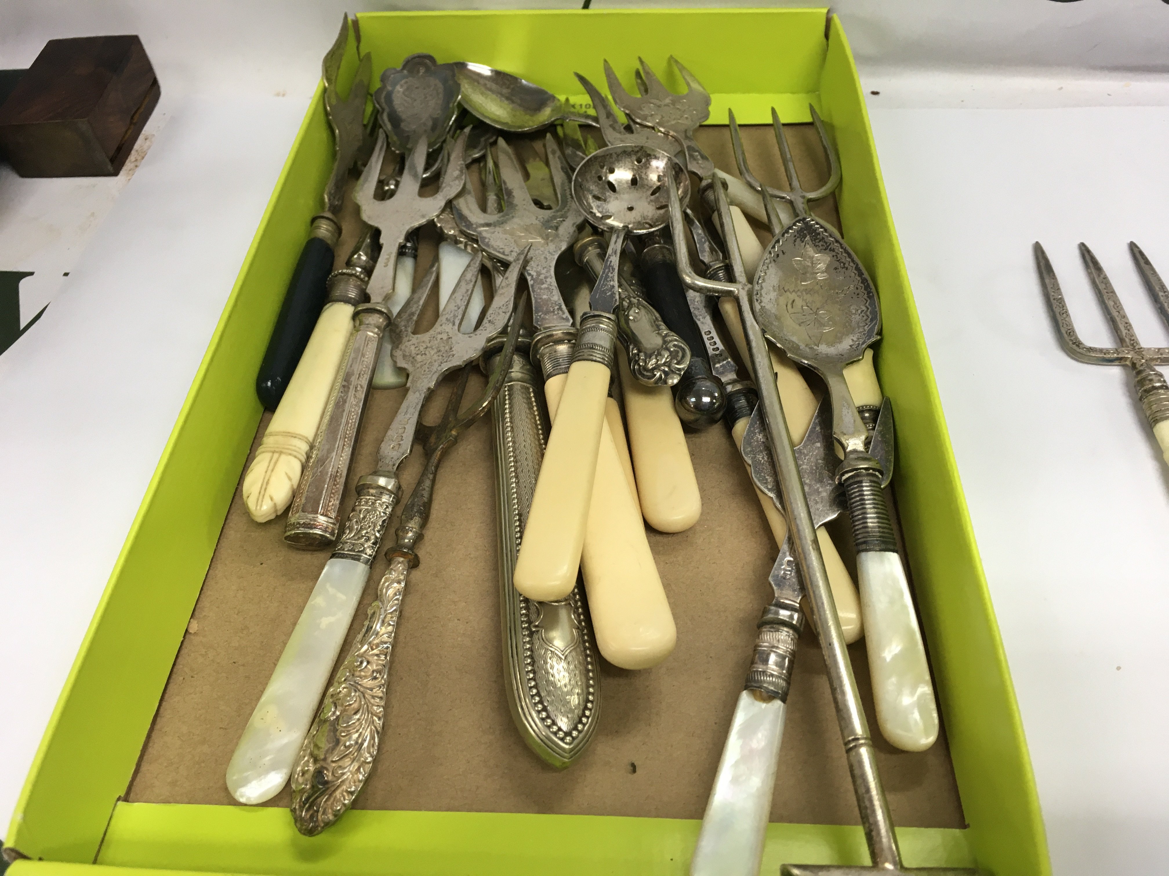 A Collection of meat forks and preserve spoons .