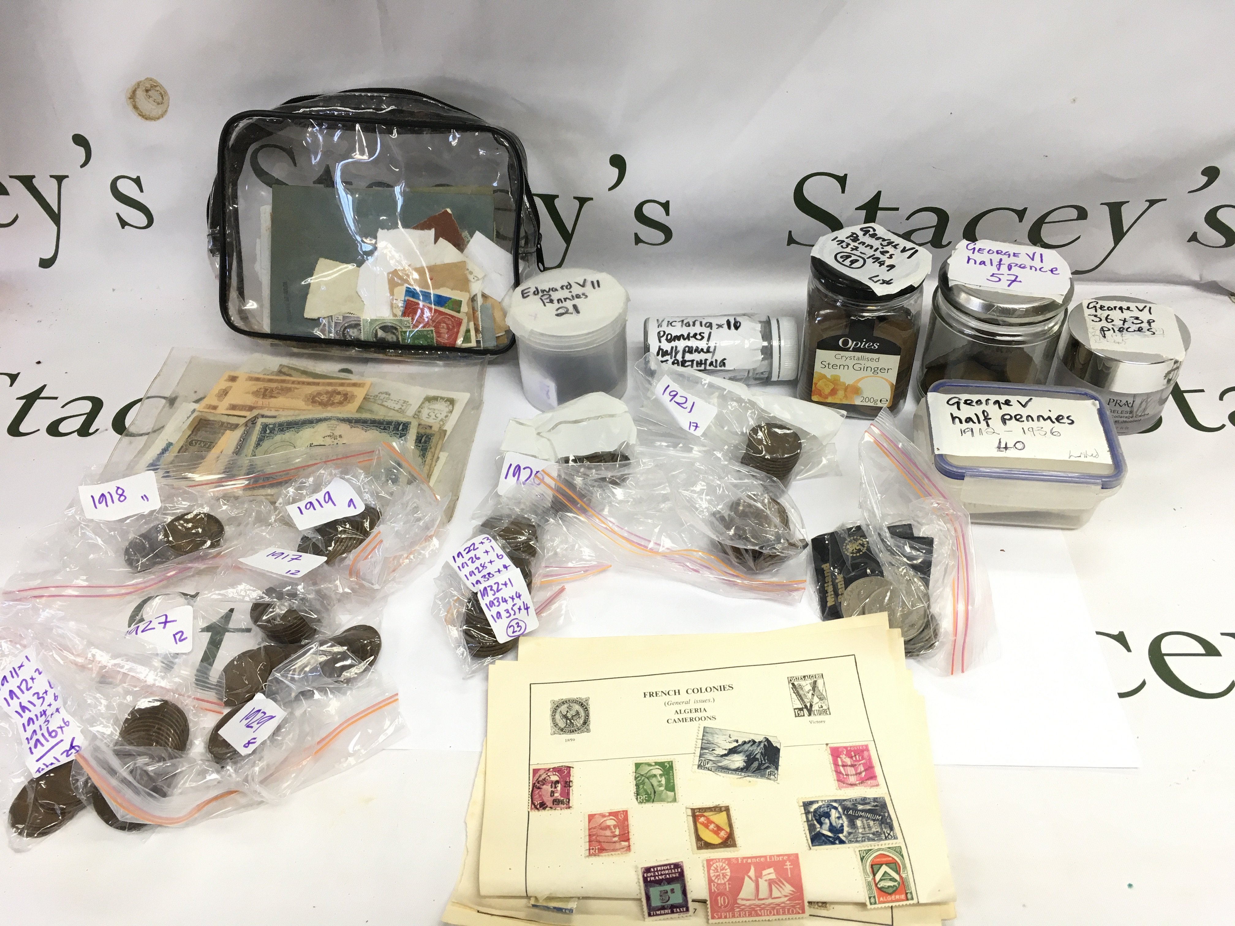 A large collection of copper coinage bank notes and small bag of stamps.