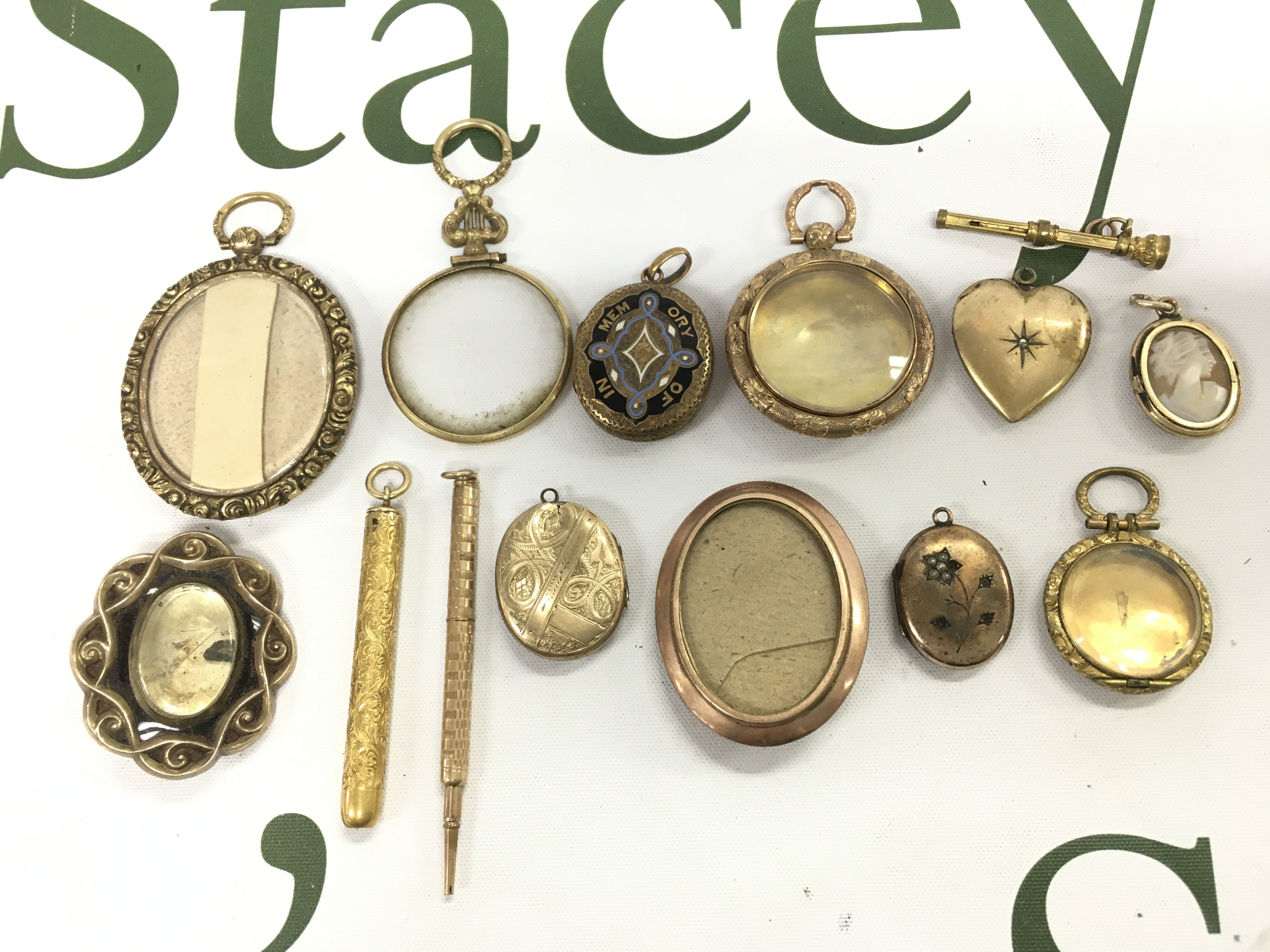 A mixed lot of rolled gold Victorian jewellery , mourning brooches, pens . Postage category A